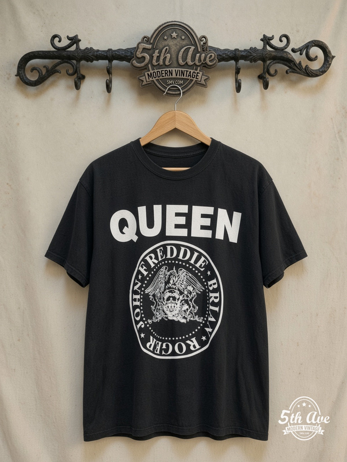 Queen – Crest Circle Member Names – Vintage Band T-Shirt — front on locked cream ornate 5th Ave rack