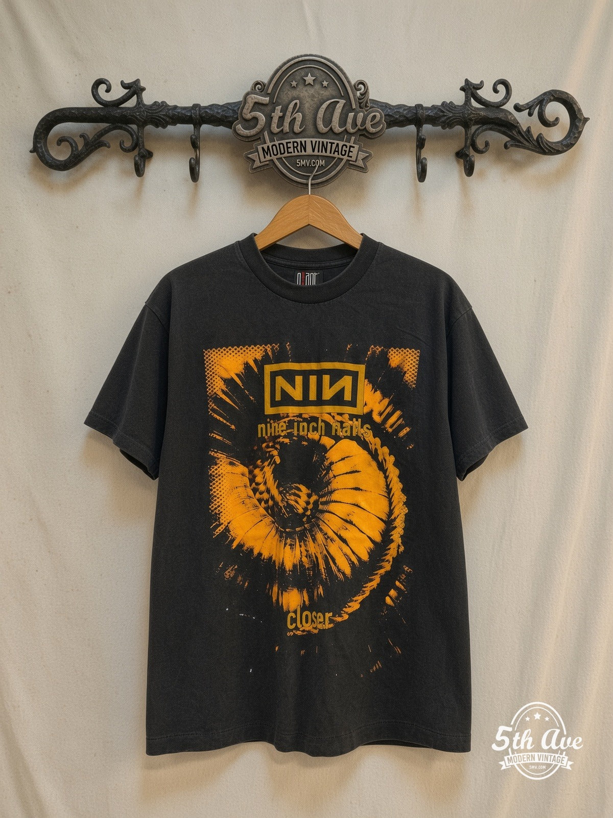 Nine Inch Nails – Closer / The Downward Spiral – Vintage Band T-Shirt — front on locked cream ornate 5th Ave rack