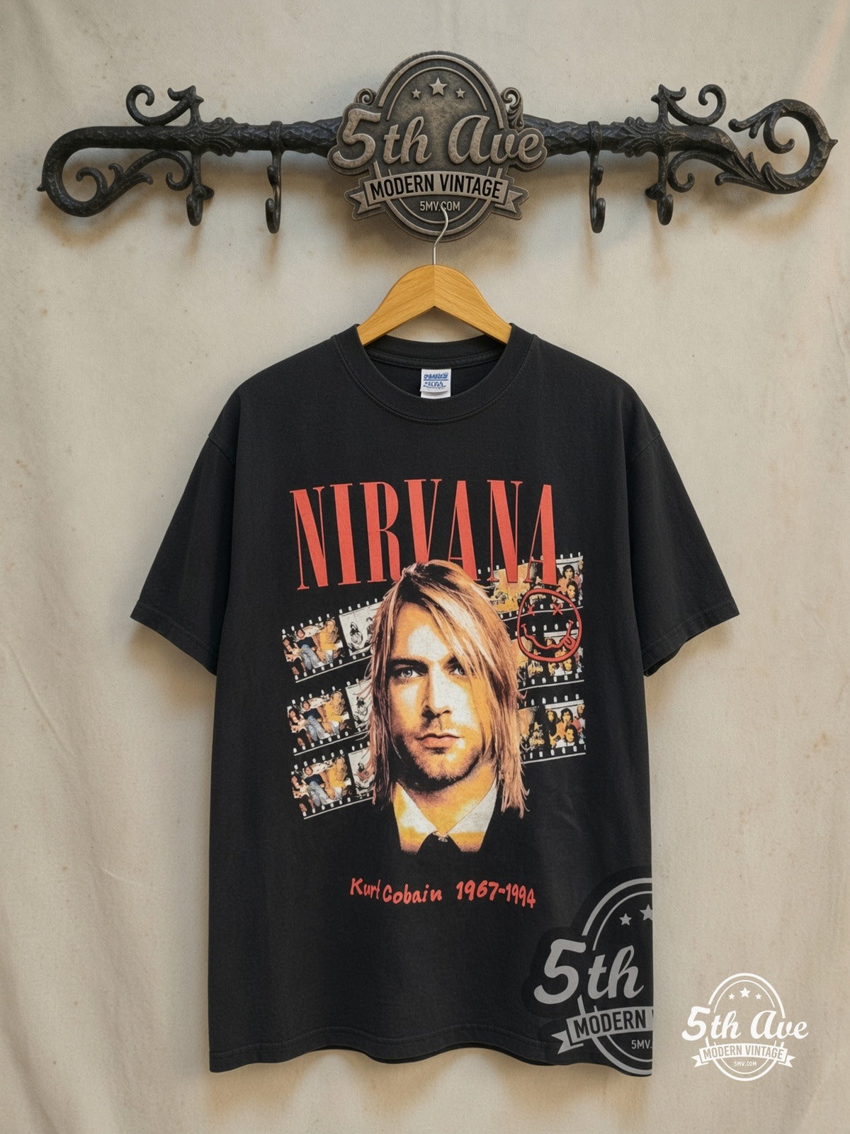 Nirvana – Kurt Cobain Filmstrip Red Logo Tribute – Vintage Band T-Shirt — front on locked cream ornate 5th Ave rack