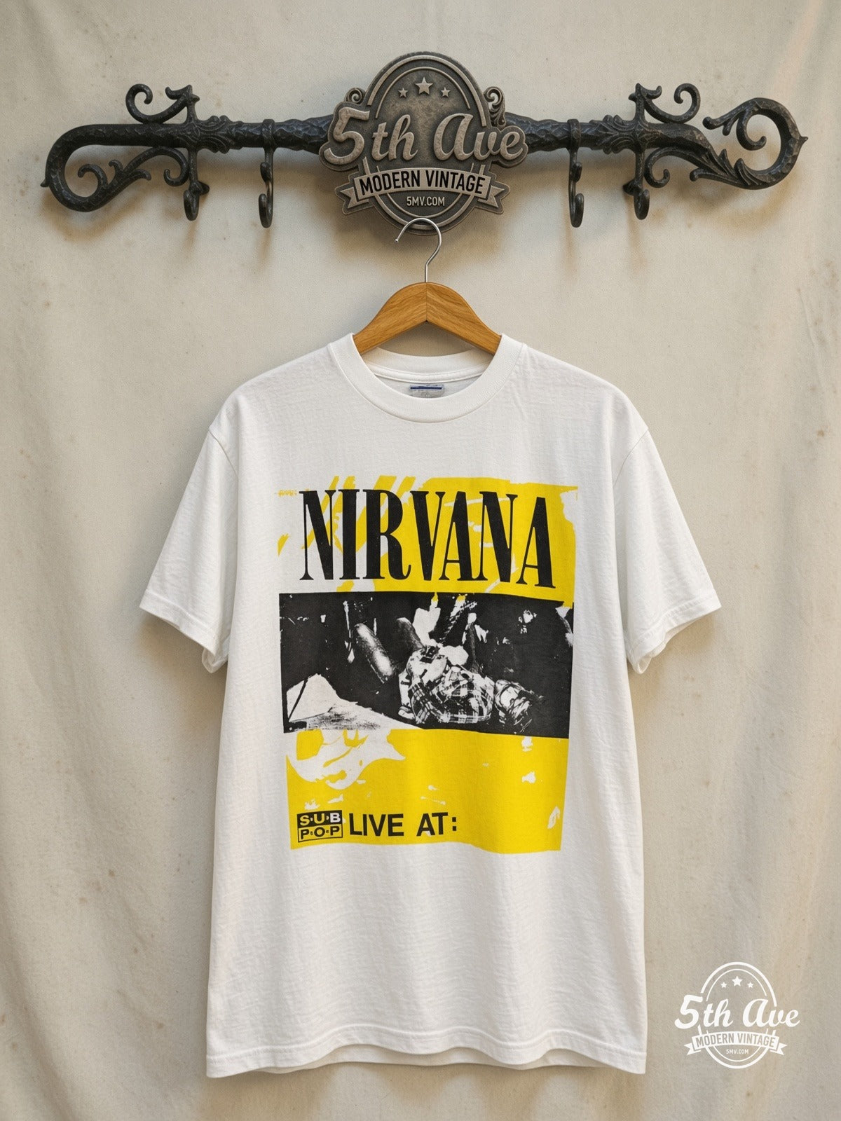 Nirvana – Bleach Sub Pop Records – Vintage Band T-Shirt — front on locked cream ornate 5th Ave rack