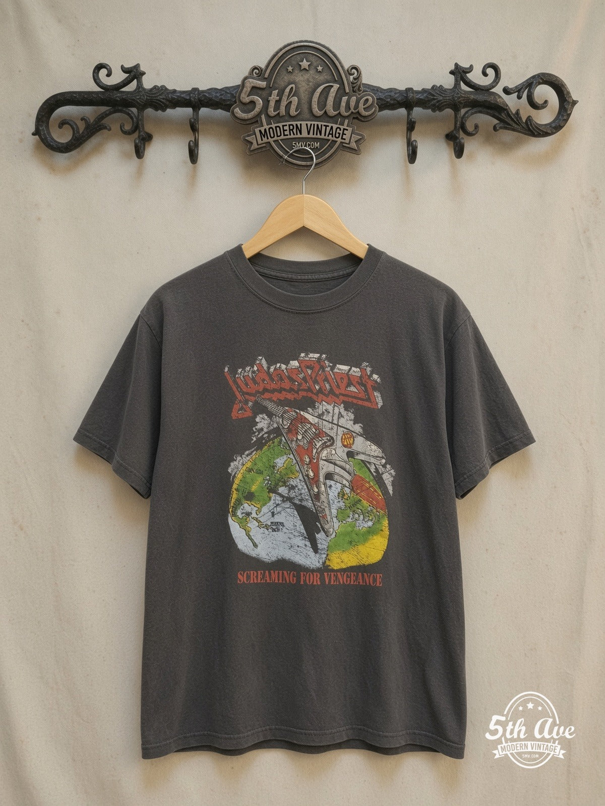 Judas Priest – Point of Entry' Electric Guitar – Vintage Band T-Shirt — front on locked cream ornate 5th Ave rack