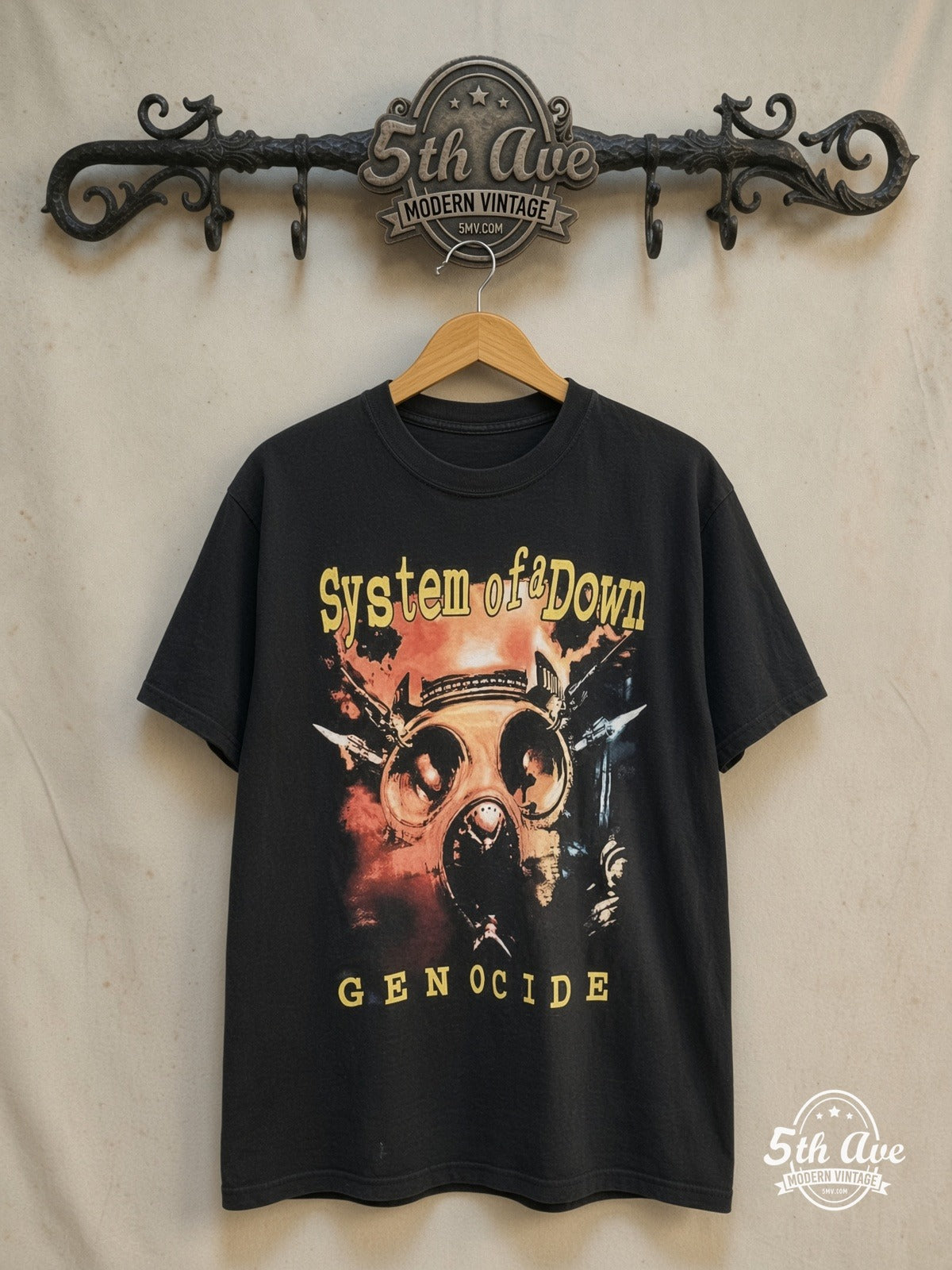 System of a Down – Genocide – Vintage Band T-Shirt — front on locked cream ornate 5th Ave rack