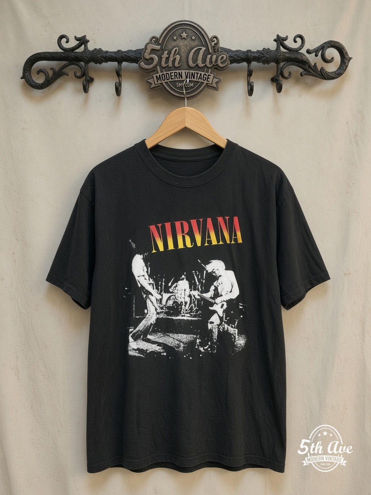 Nirvana – Sunset Logo Live Trio Photo – Vintage Band T-Shirt — front on locked cream ornate 5th Ave rack