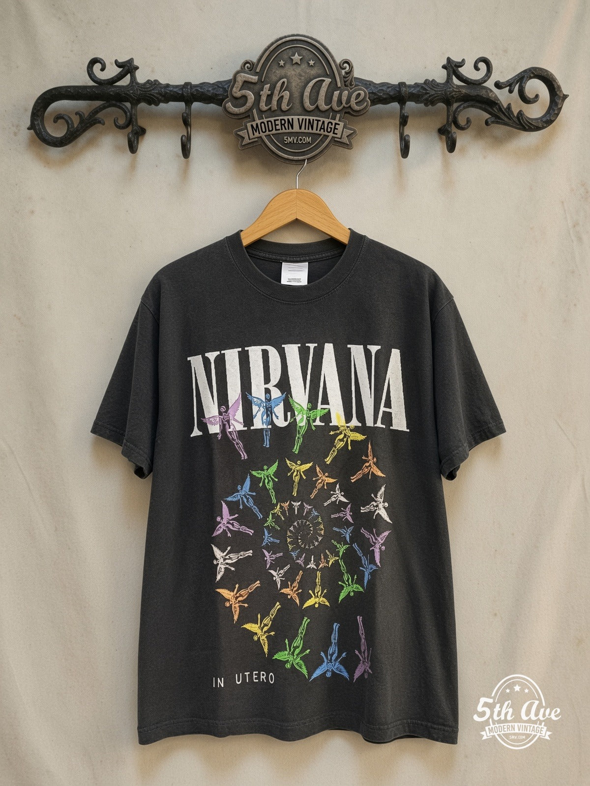 Nirvana – In Utero Colorful Angel – Vintage Band T-Shirt — front on locked cream ornate 5th Ave rack