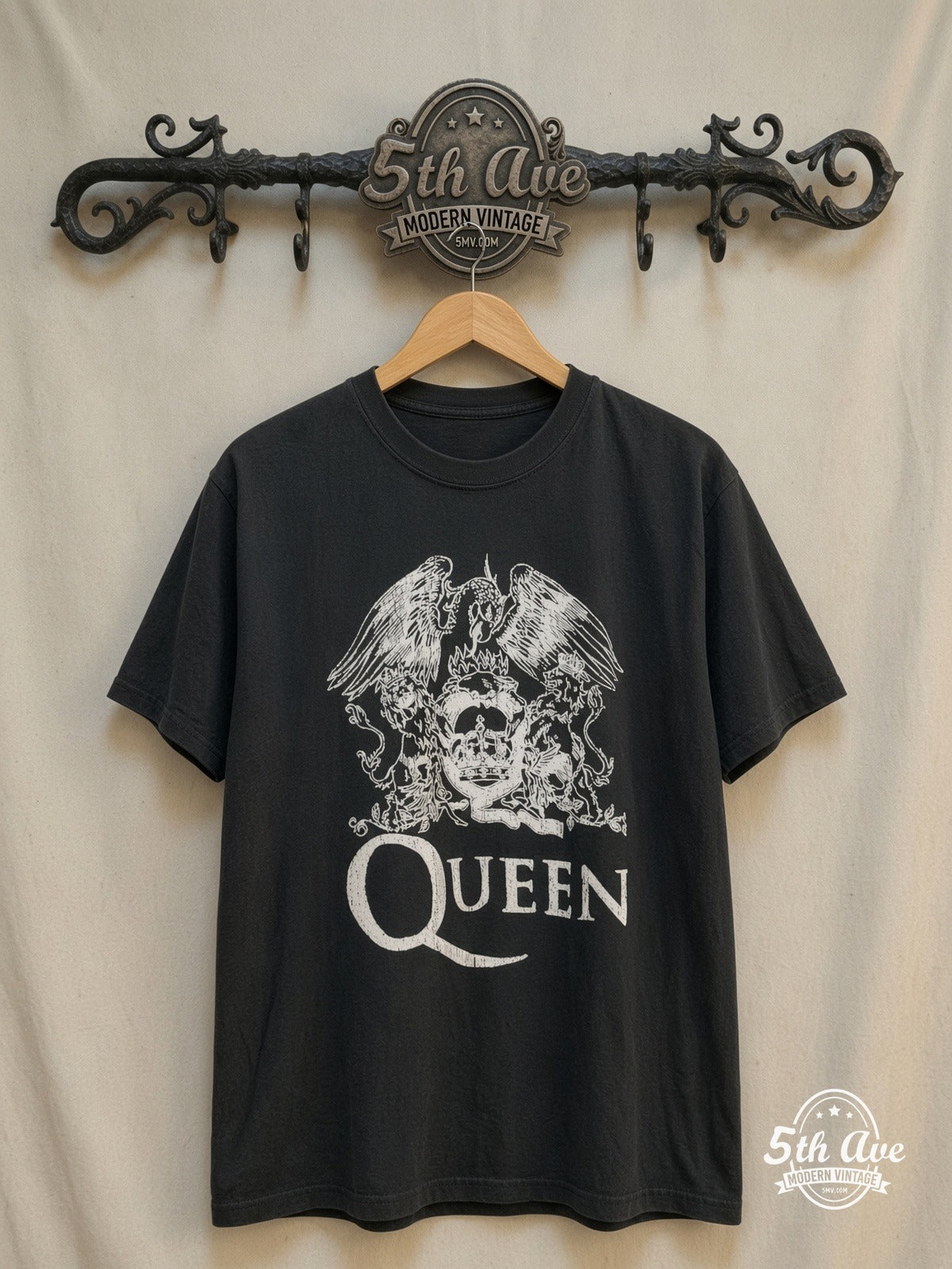 Queen – Classic Crest White Print – Vintage Band T-Shirt — front on locked cream ornate 5th Ave rack