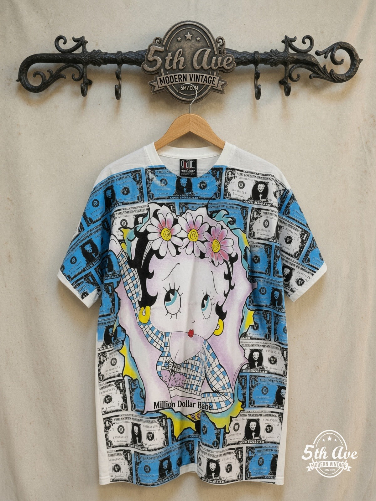 Betty Boop – Million Dollar Babe Black T-Shirt Stylish Look – All Over Print – New Vintage Graphic Tee — front on locked cream ornate 5th Ave rack