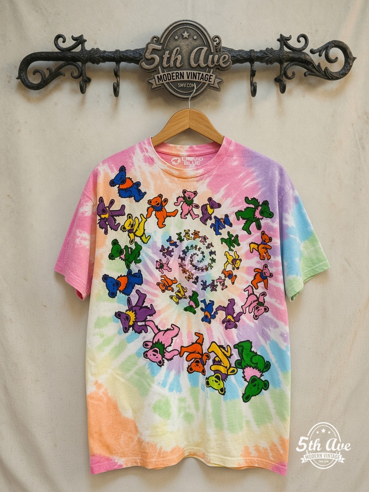 Grateful Dead – Spiral Bear Tie Dye – Vintage Band T-Shirt — front on locked cream ornate 5th Ave rack