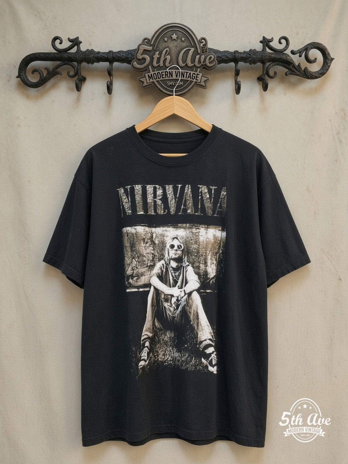 Kurt Cobain – Nirvana Retro Portrait – Vintage Band T-Shirt — front on locked cream ornate 5th Ave rack