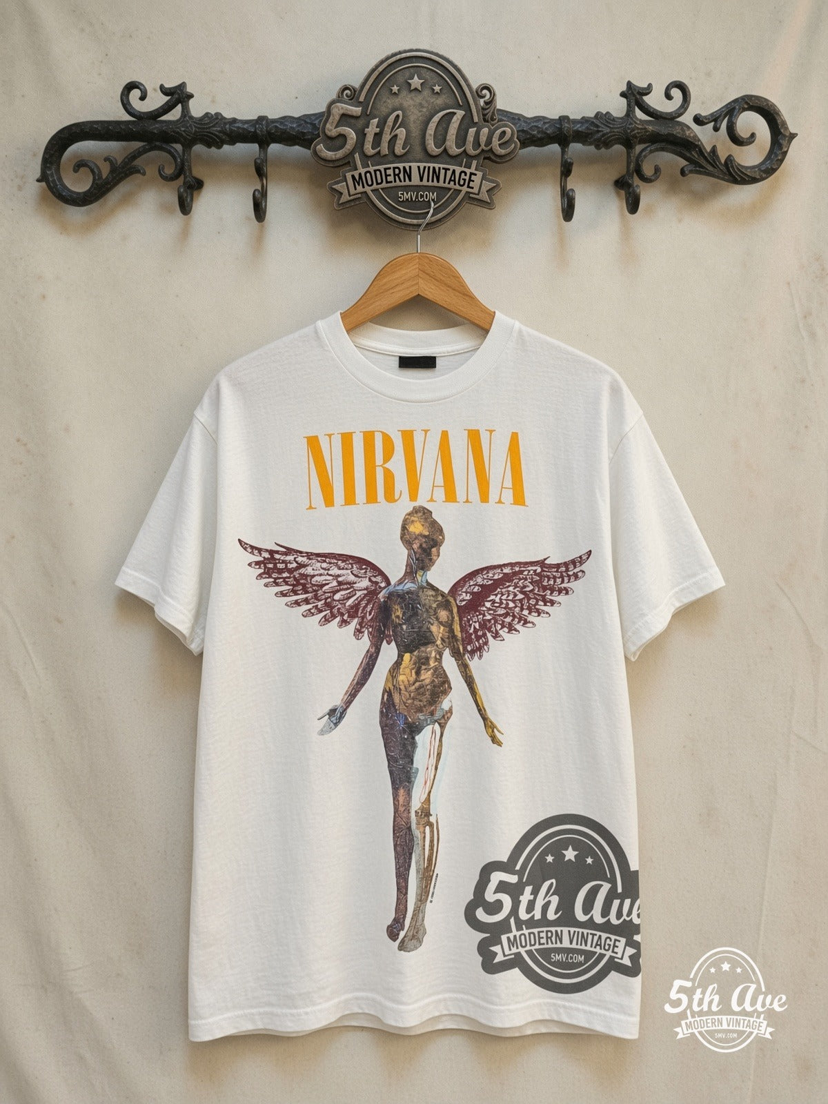 Nirvana – In Utero Yellow Logo Angel Back Print – Vintage Band T-Shirt — front on locked cream ornate 5th Ave rack