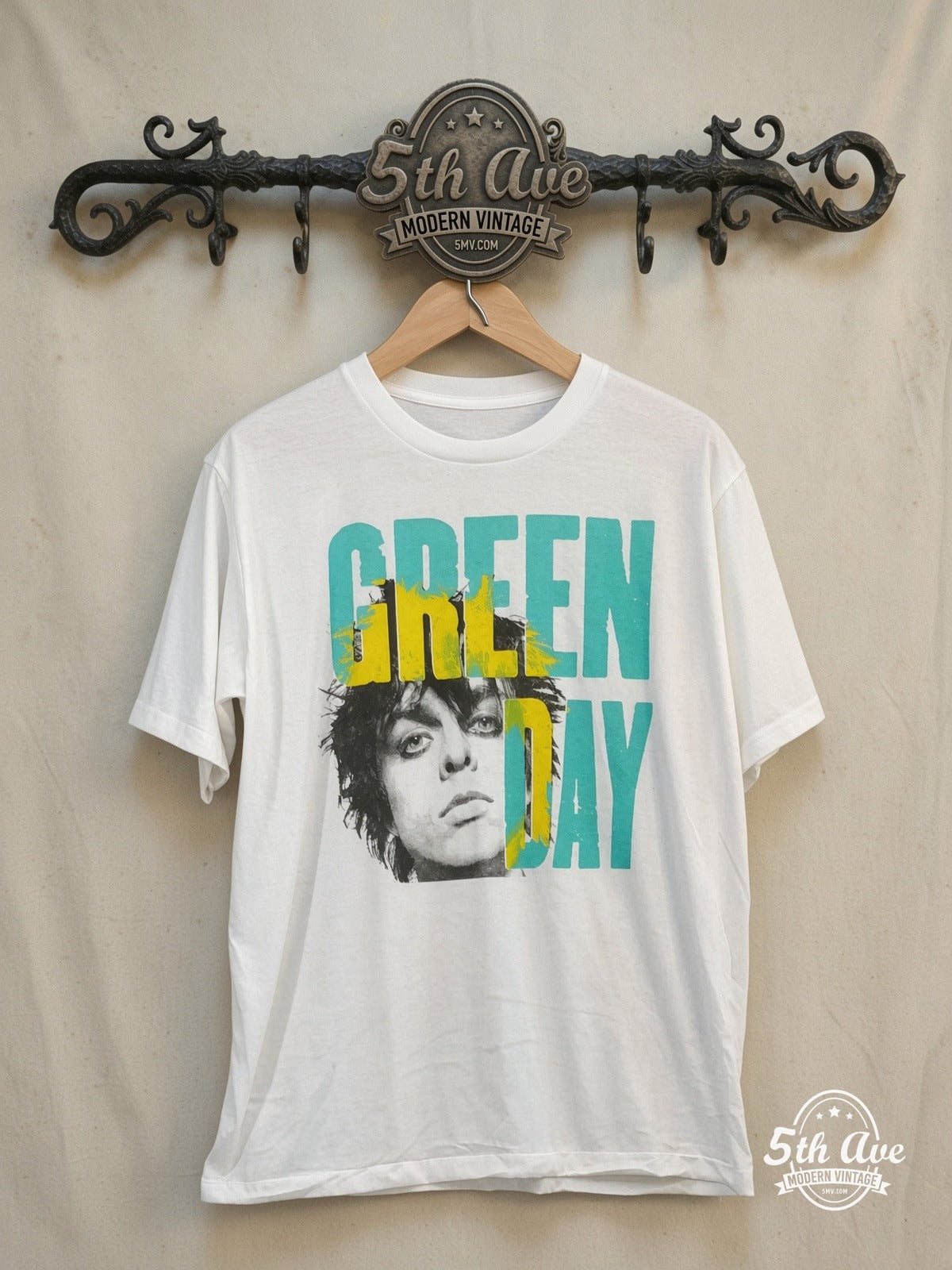 Green Day 100% Cotton New Vintage Band Graphic T-Shirt – Vintage Band T-Shirt — front on locked cream ornate 5th Ave rack