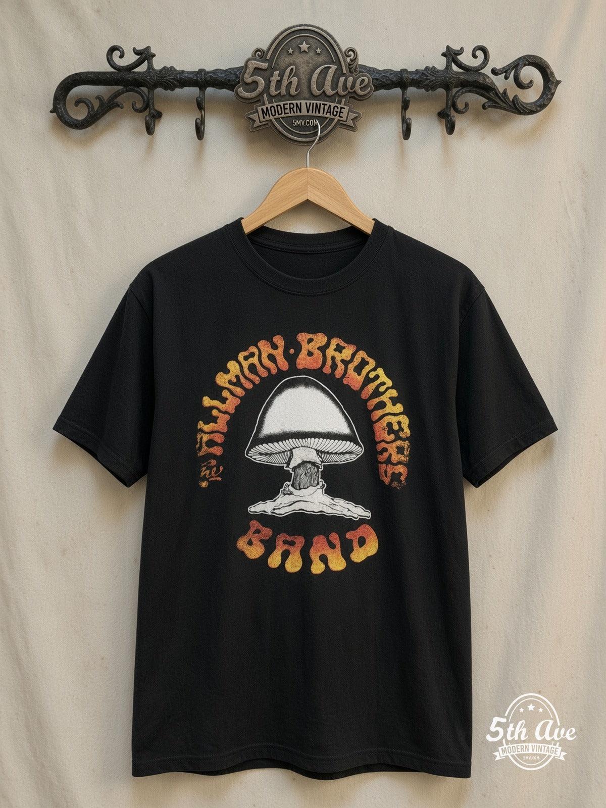 The Allman Brothers Band – Mushroom Logo Orange Gradient Text – Vintage Band T-Shirt — front on locked cream ornate 5th Ave rack