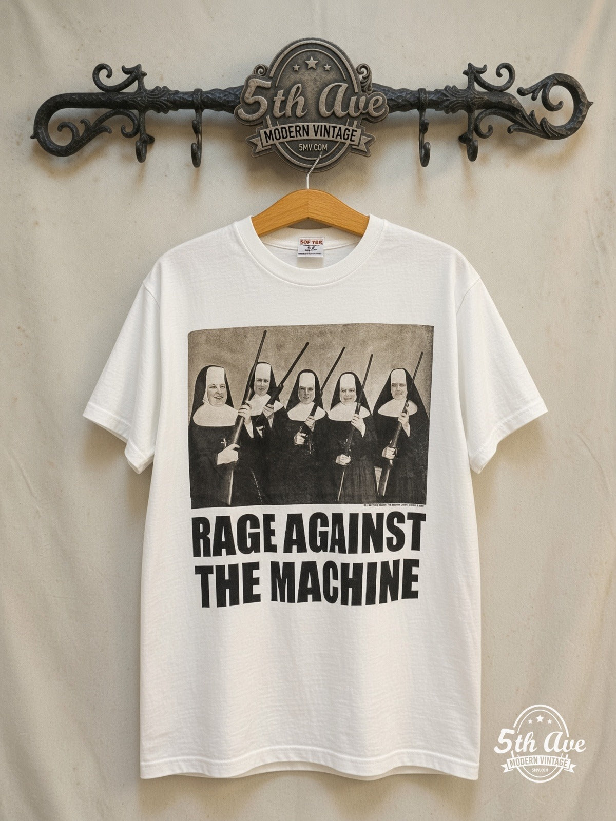 Rage Against the Machine – Nuns And Guns – Vintage Band T-Shirt — front on locked cream ornate 5th Ave rack