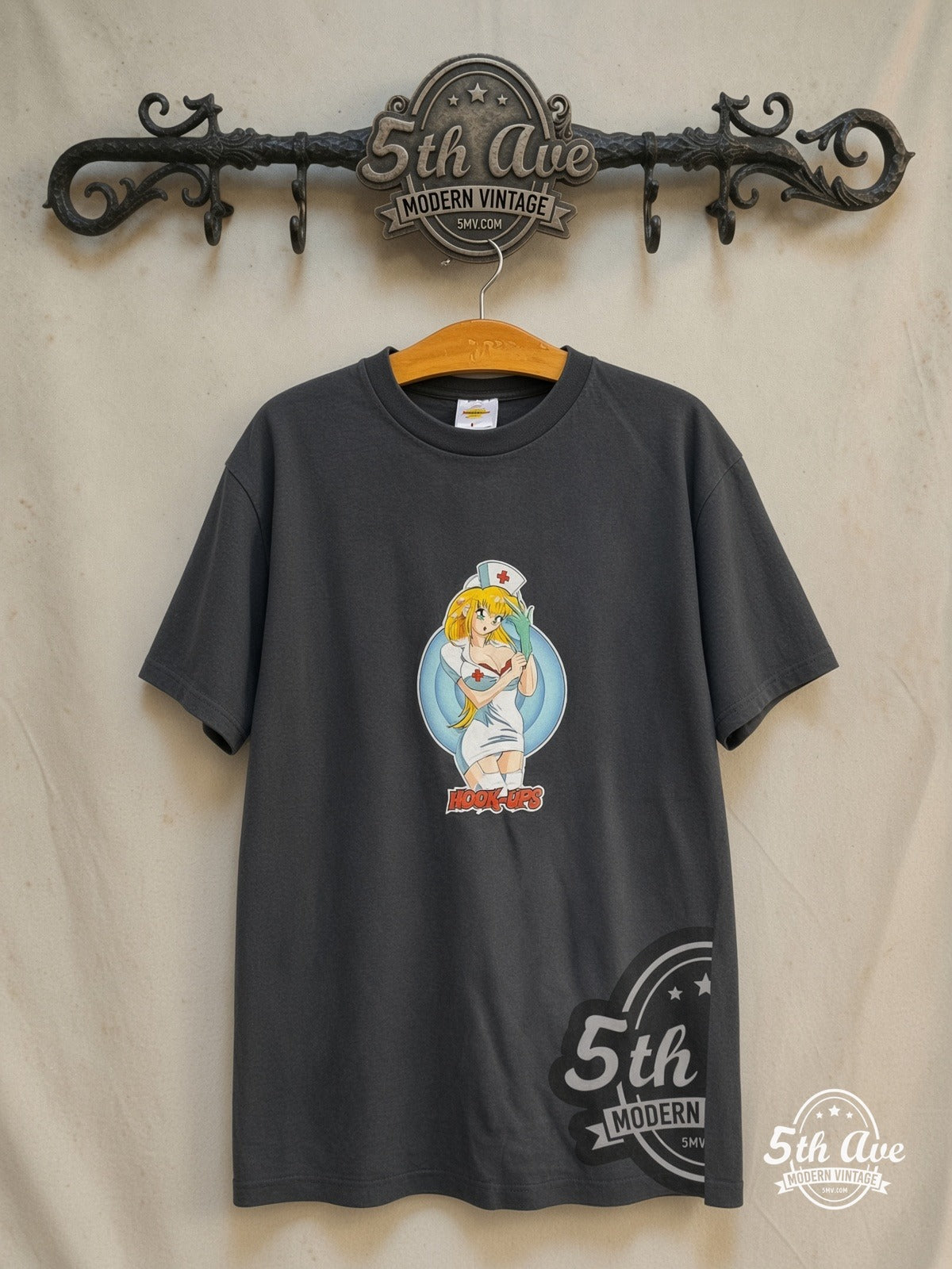 Hook-Ups – Nurse Daisy – Vintage Graphic Tee — front on locked cream ornate 5th Ave rack