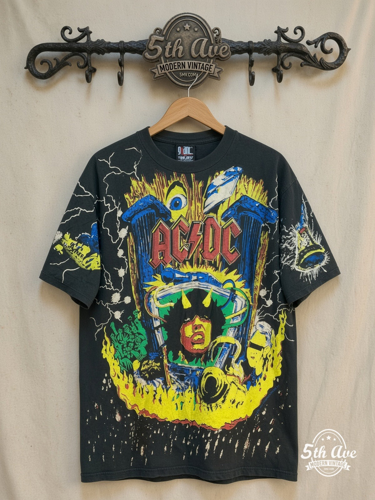 AC/DC – Angus Young Thunderstruck – All Over Print – Vintage Band T-Shirt — front on locked cream ornate 5th Ave rack