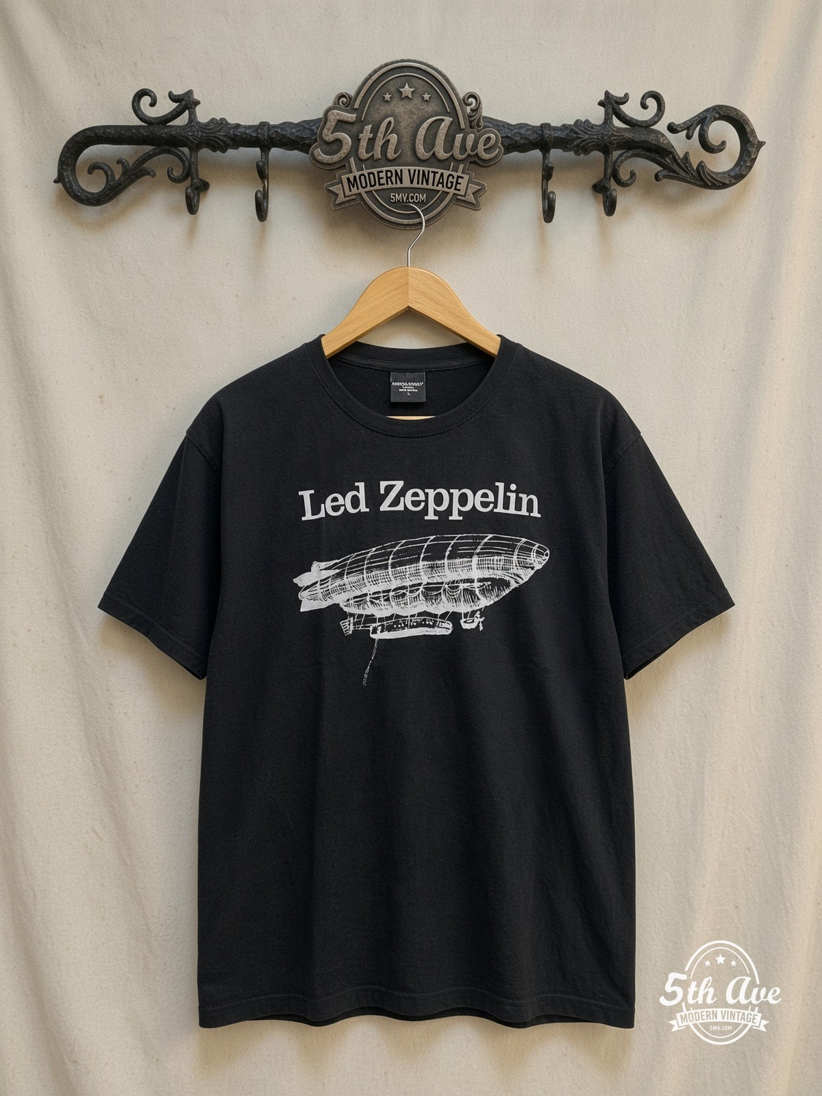 Led Zeppelin – White Zeppelin Airship Logo – Vintage Band T-Shirt — front on locked cream ornate 5th Ave rack
