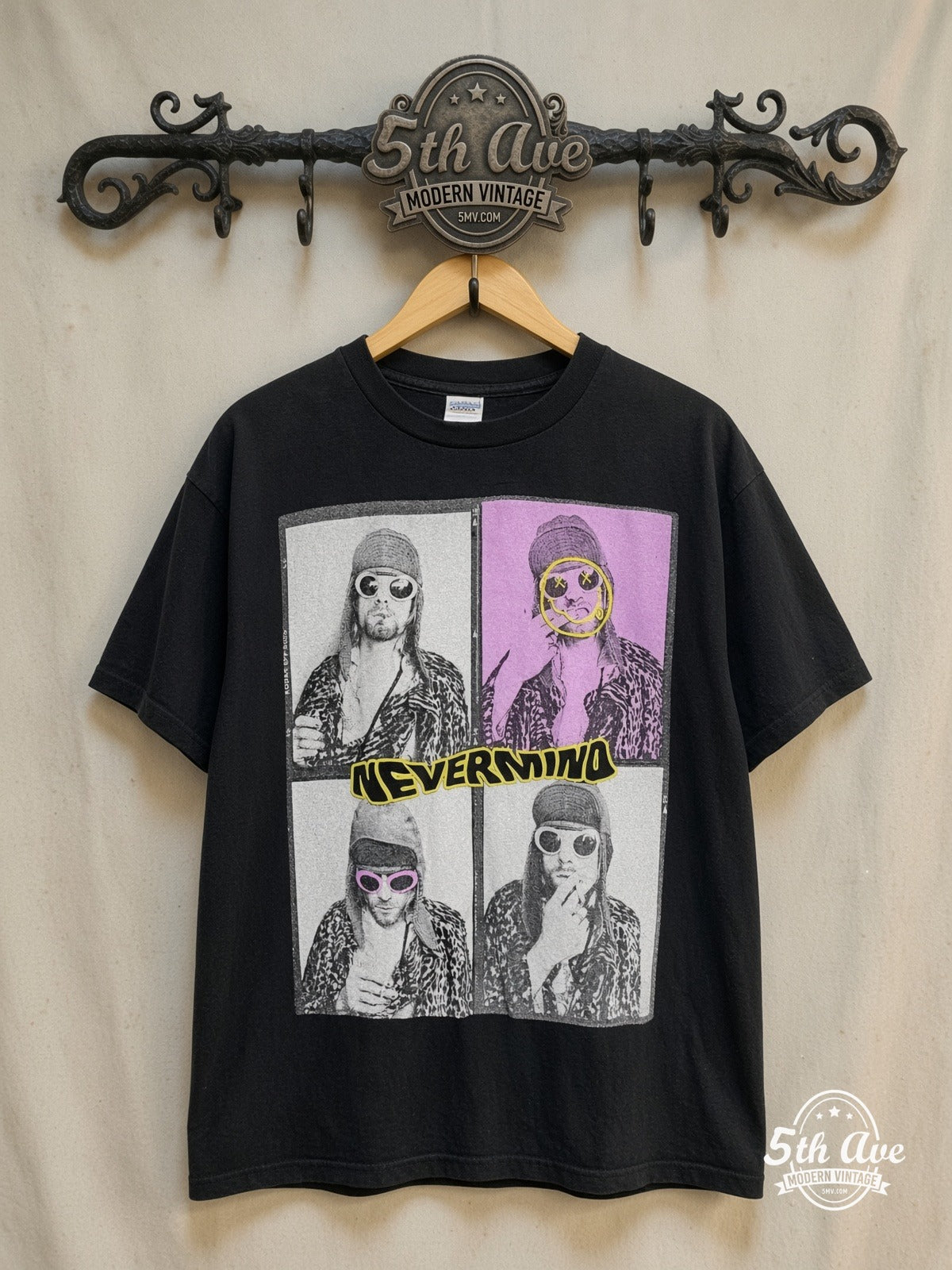 Nirvana – Nevermind Four-Panel Kurt Leopard Grid – Vintage Band T-Shirt — front on locked cream ornate 5th Ave rack