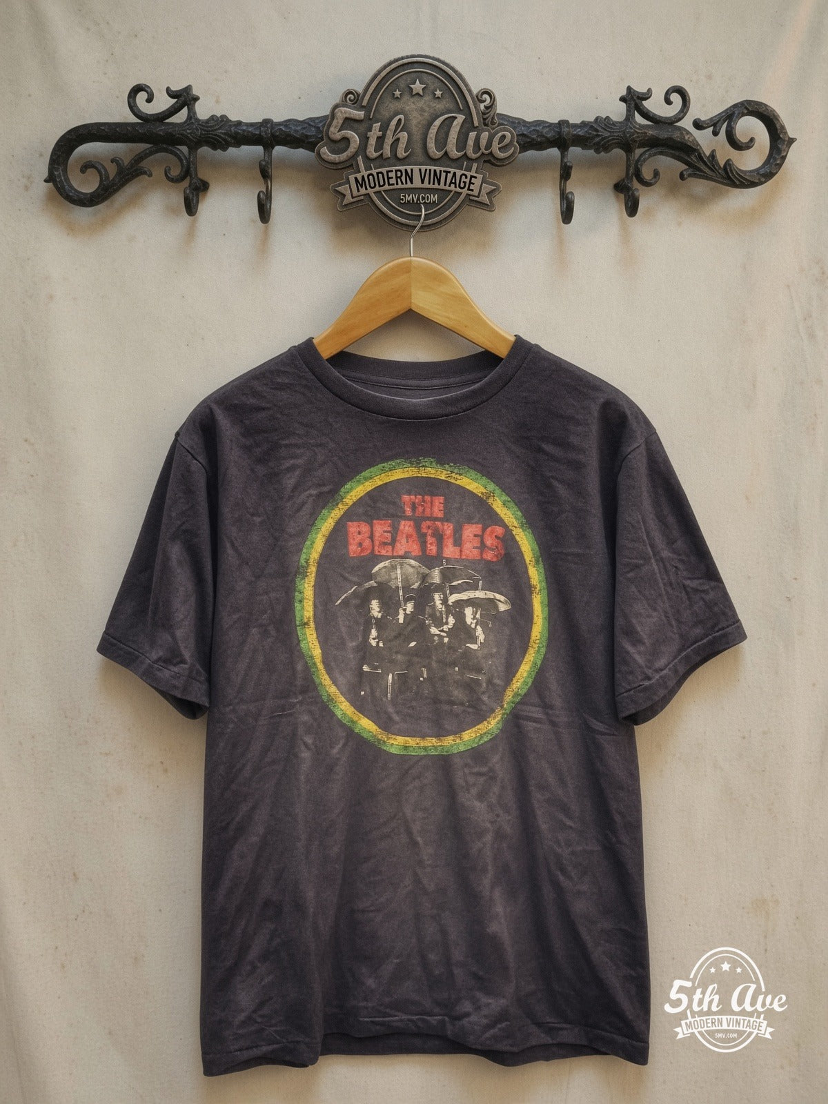 The Beatles – 100% Cotton New Vintage Band T-Shirt – Vintage Band T-Shirt — front on locked cream ornate 5th Ave rack