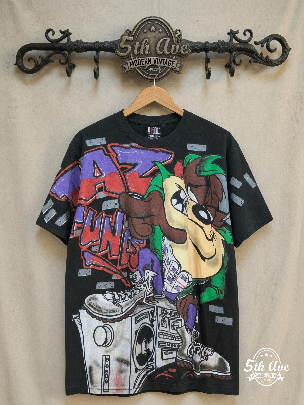 Looney Tunes – Taz-Mania Wild Style – All Over Print – New Vintage Graphic Tee — front on locked cream ornate 5th Ave rack