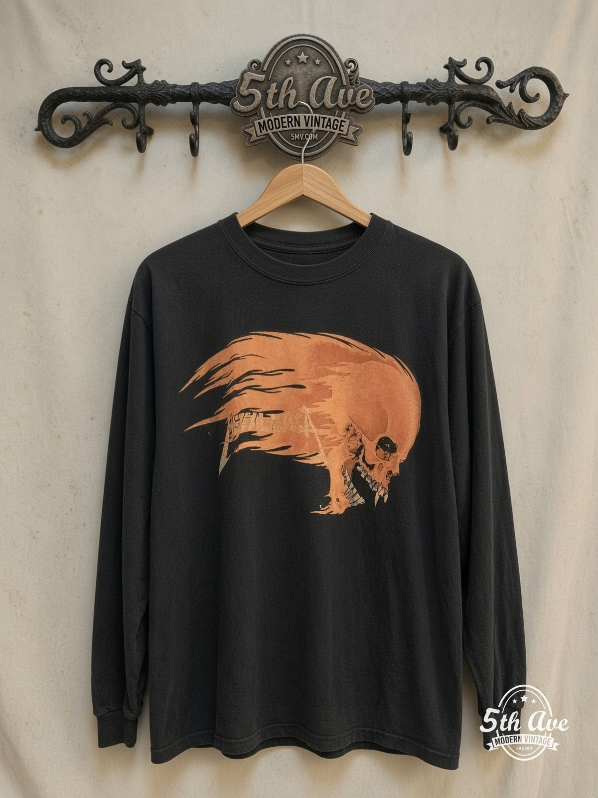 Metallica Inferno Flaming Skull vintage band t-shirt, front view on a display rack