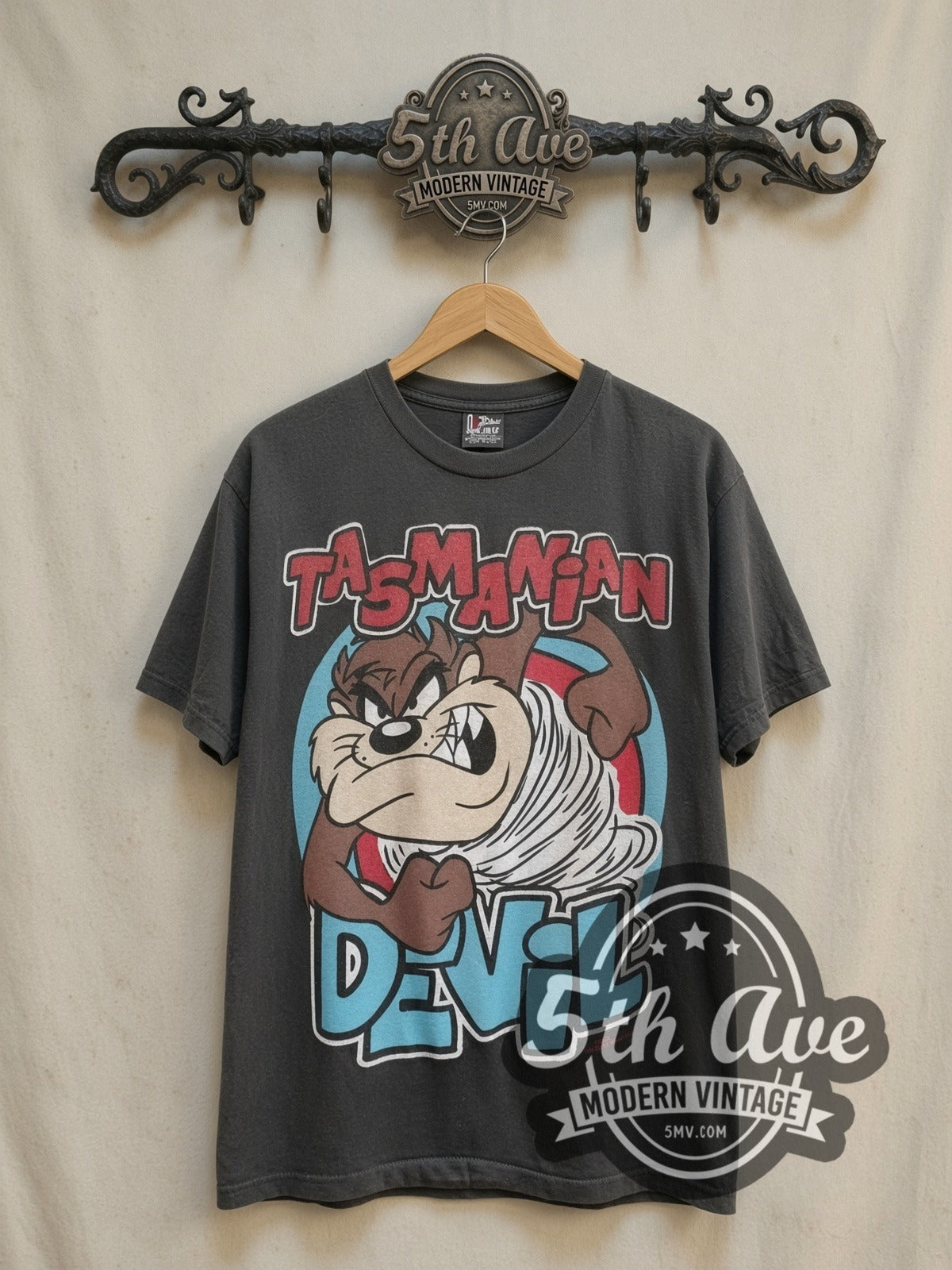 Taz's Gym No Pencilnecks Black vintage cartoon tee in black, front view on a display rack