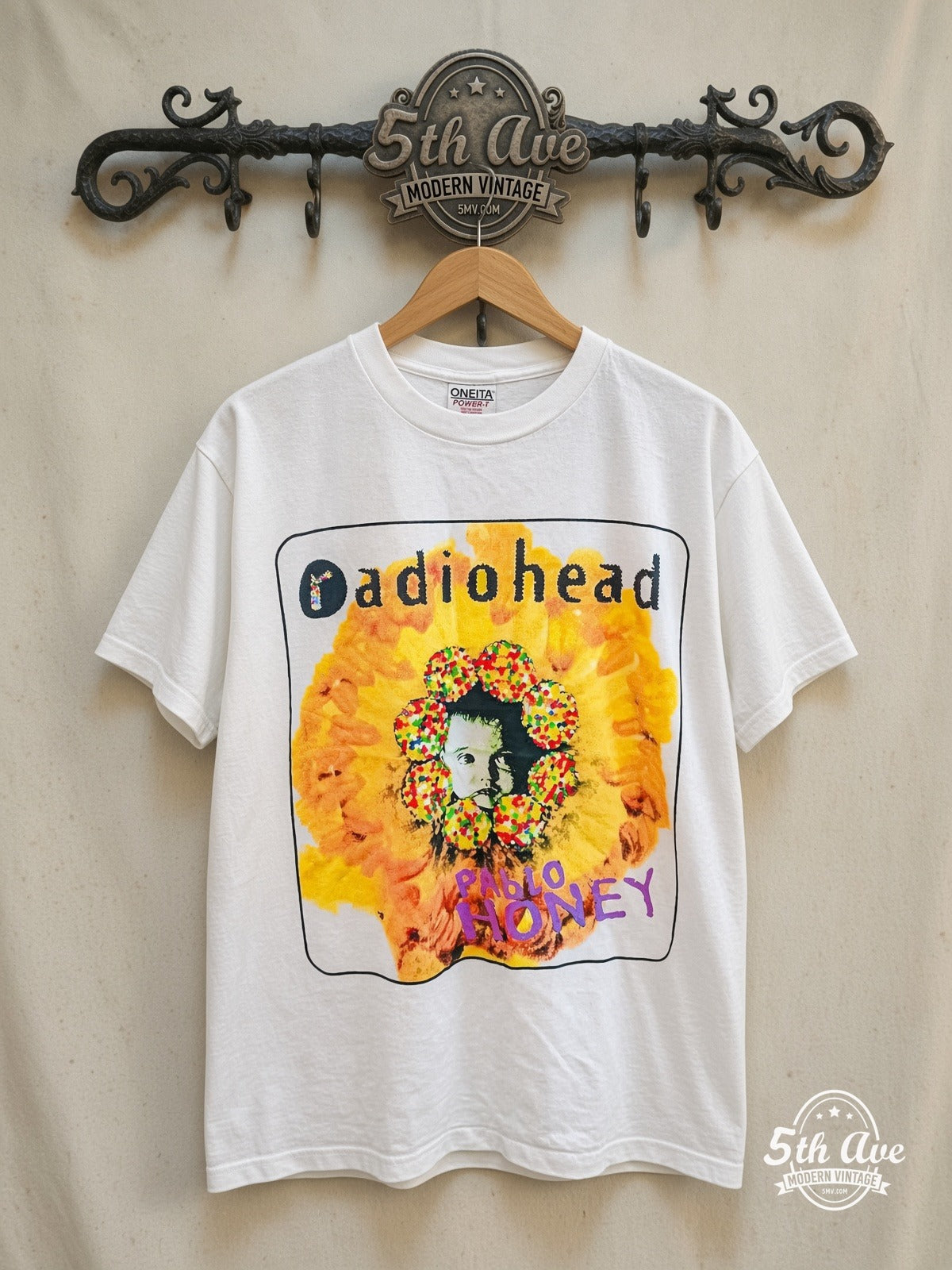 Radiohead – Pablo Honey Baby Sunflower Bloom – Vintage Band T-Shirt — front on locked cream ornate 5th Ave rack