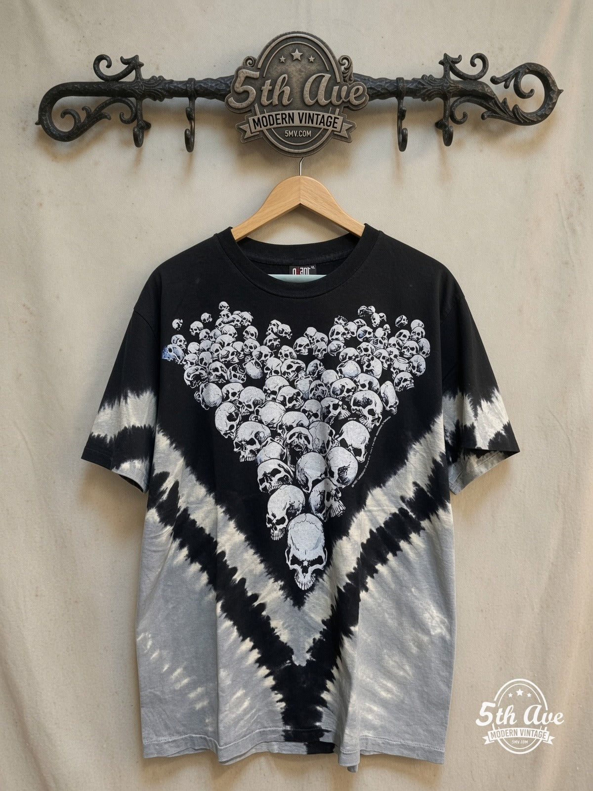 Universe of Transformations: Tie-Dye Artistry Tee – All Over Print – Vintage Band T-Shirt — front on locked cream ornate 5th Ave rack