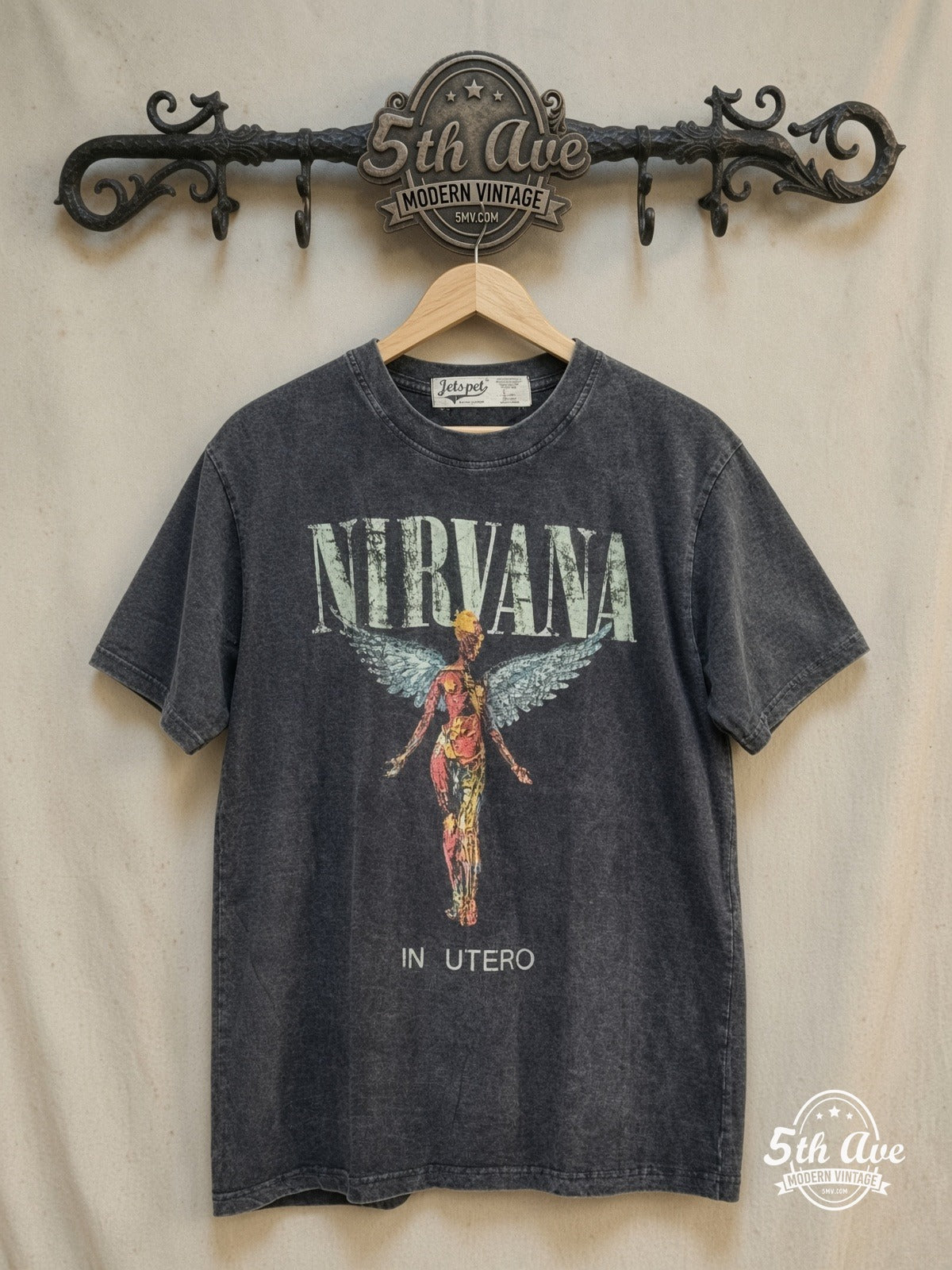 Nirvana – In Utero Stone Wash Anatomical Angel – Vintage Band T-Shirt — front on locked cream ornate 5th Ave rack