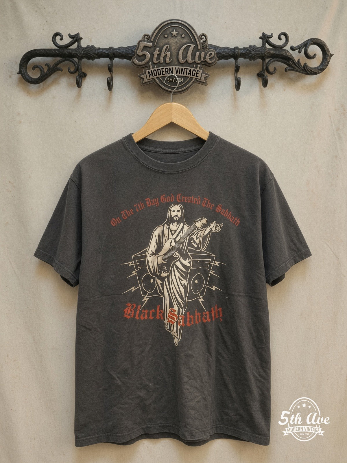 Transcendent Harmony: Black Sabbath Divine Riffs – Vintage Band T-Shirt — front on locked cream ornate 5th Ave rack