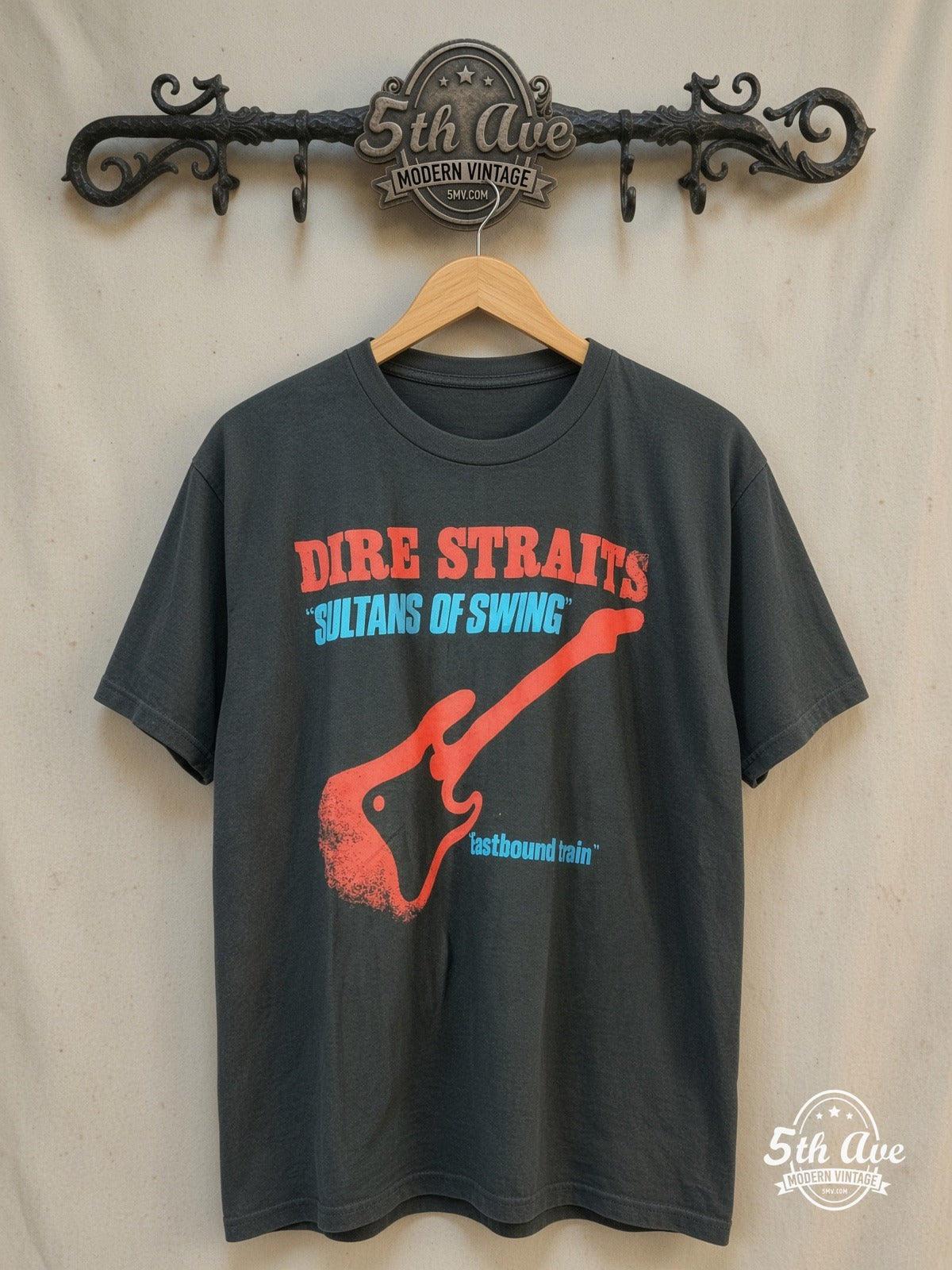 Dire Straits – Sultans of Swing – Vintage Band T-Shirt — front on locked cream ornate 5th Ave rack