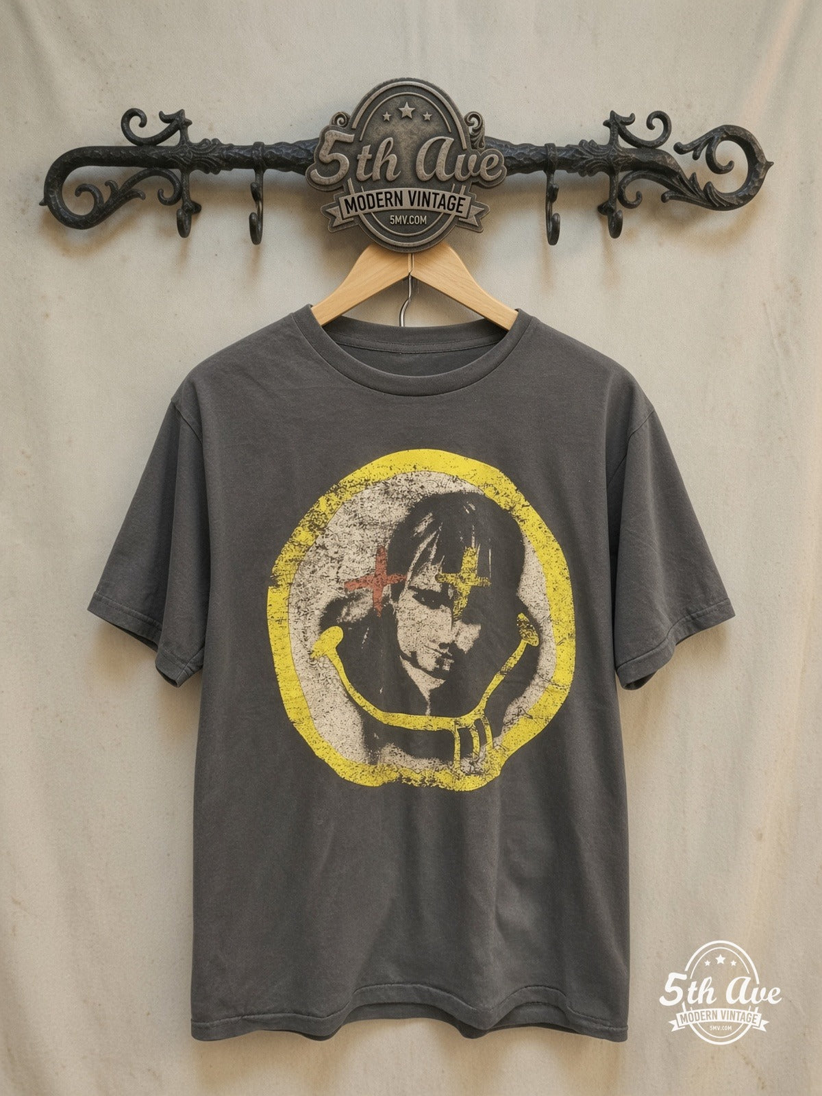 Nirvana – Kurt Cobain Cross-Eyes Yellow Circle Portrait – Vintage Band T-Shirt — front on locked cream ornate 5th Ave rack
