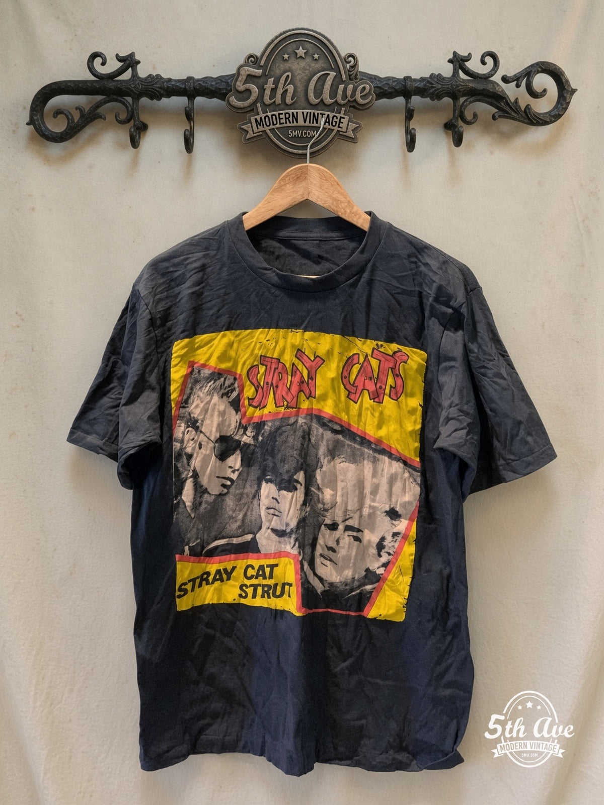 Stray Cats – Stray Cat Strut Yellow Band Photo – Vintage Band T-Shirt front on locked cream ornate 5th Ave rack