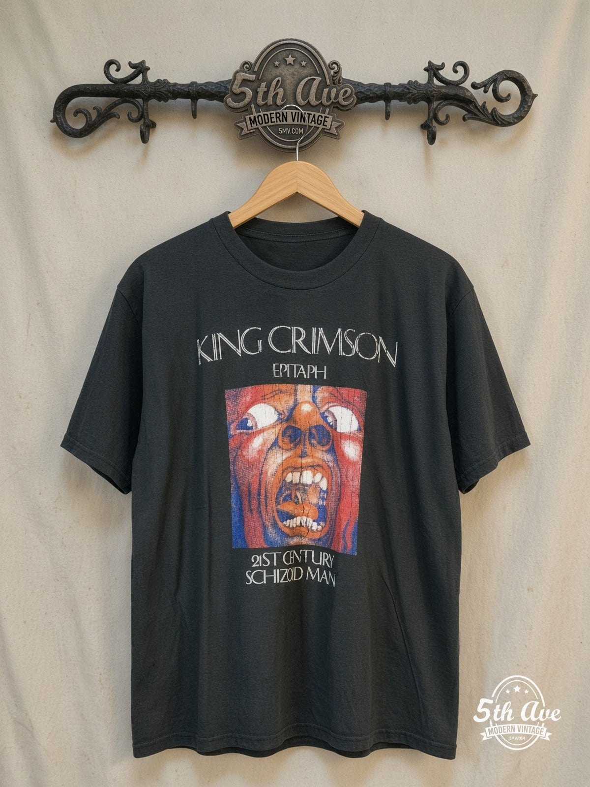 King Crimson – Epitaph Schizoid Man Washed Black – Vintage Band T-Shirt — front on locked cream ornate 5th Ave rack