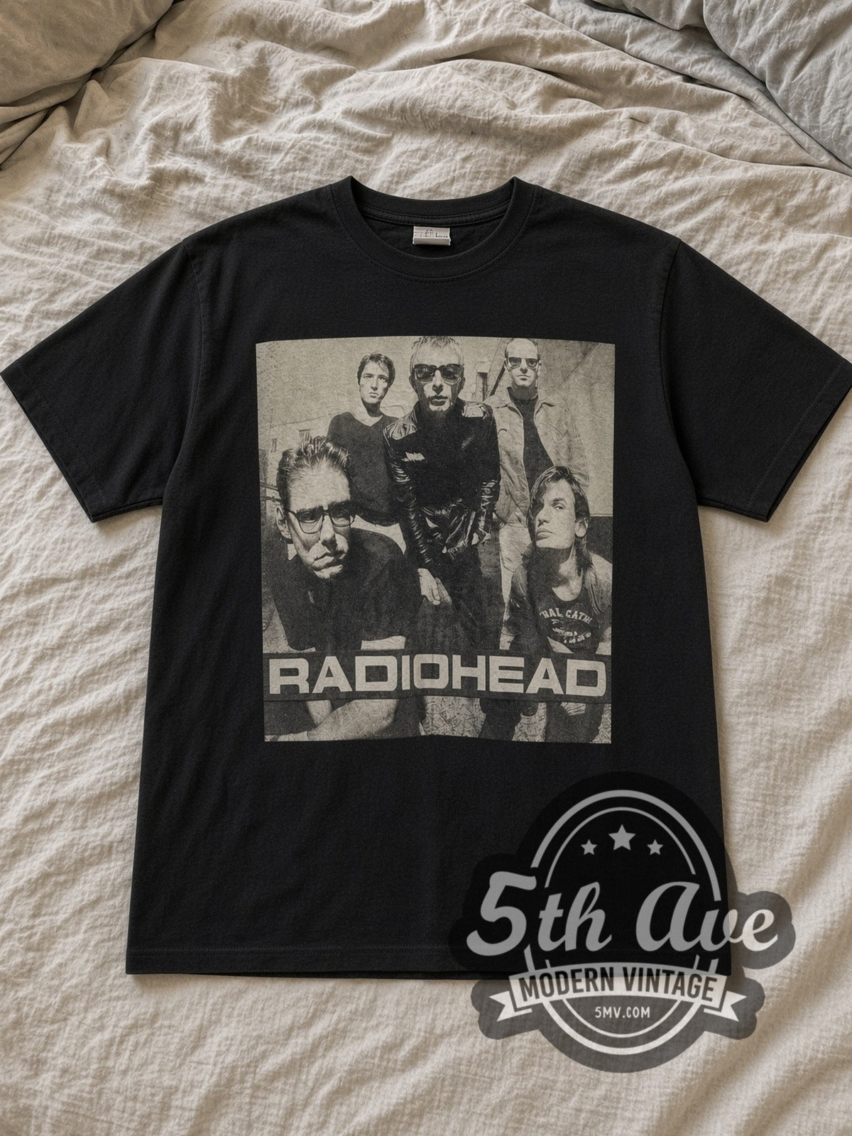 Black Radiohead Monochrome Band Photo Block Logo Vintage Band T-Shirt laid flat on a linen bed