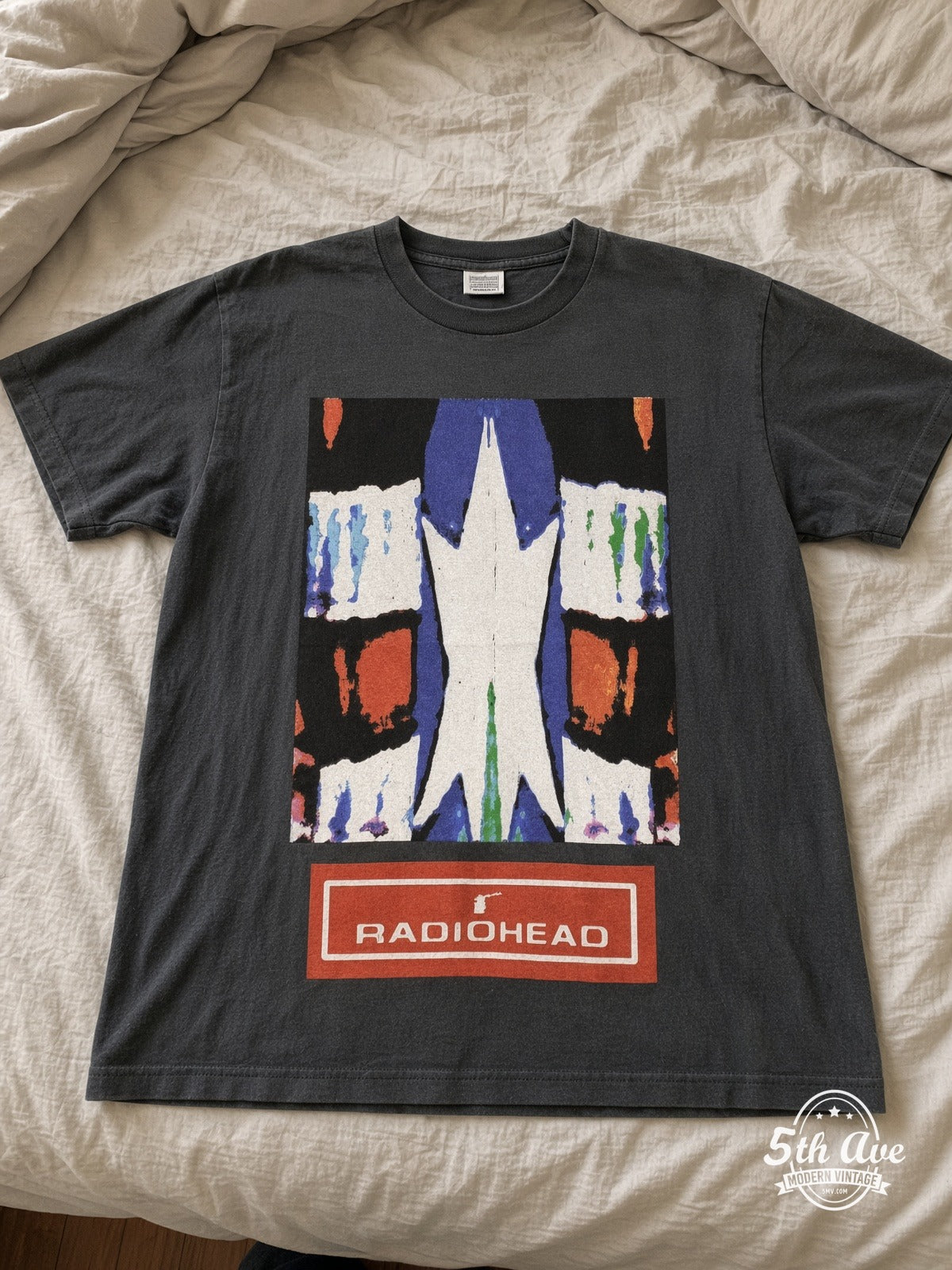 Radiohead Abstract Square Tour Map vintage tee laid on bed