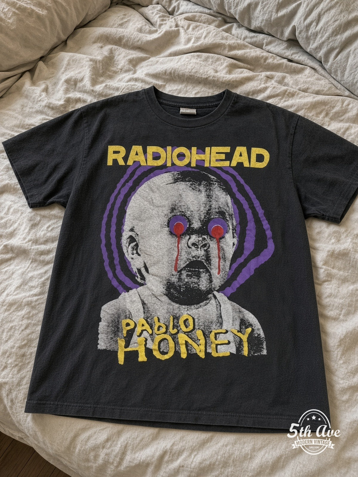 Radiohead Pablo Honey Purple Spiral Baby vintage tee laid on bed