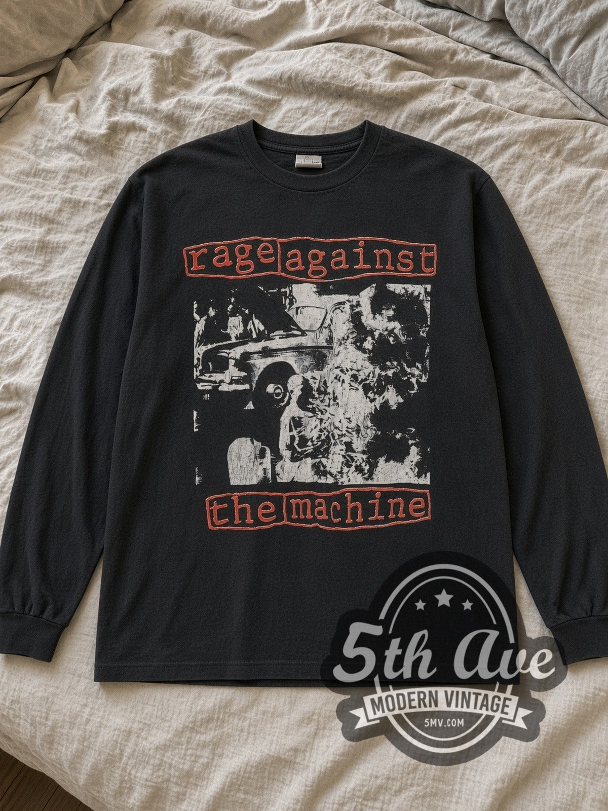 Black Rage Against the Machine Burning Monk I Won't Do What You Tell Me Vintage Band Long Sleeve T-Shirt laid flat on a linen bed