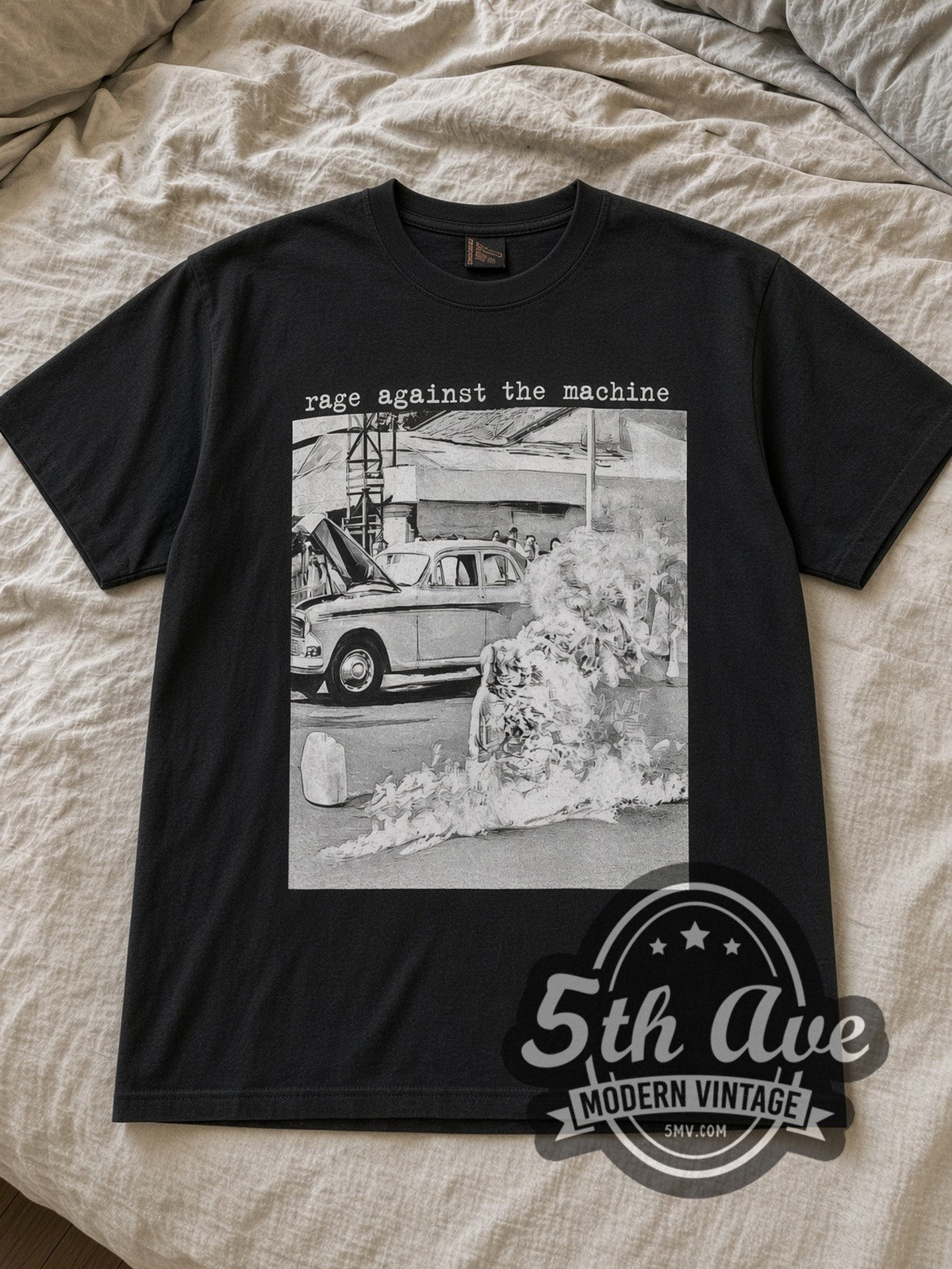 Black Rage Against the Machine Burning Monk Monochrome Vintage Band T-Shirt laid flat on a linen bed