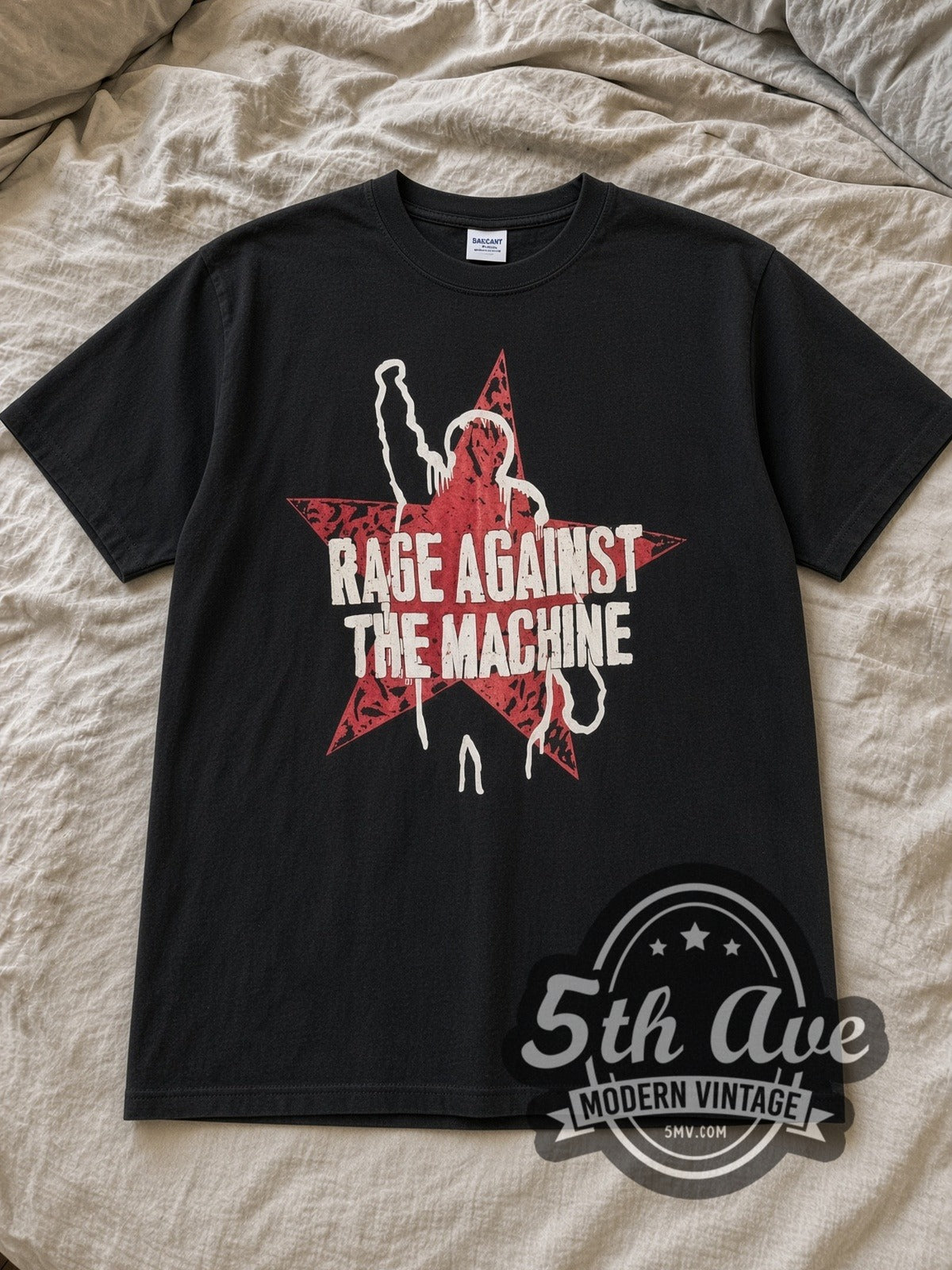 Black Rage Against the Machine Vintage Band T-Shirt laid flat on a linen bed