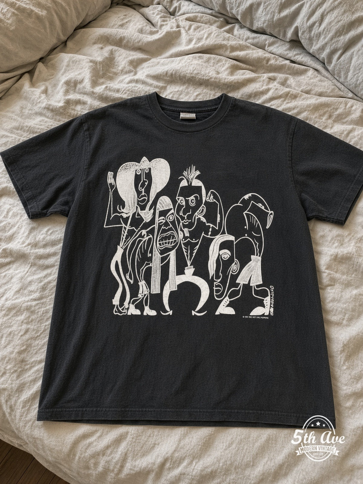 Red Hot Chili Peppers 1991 Caricatures Asterisk vintage tee laid on bed