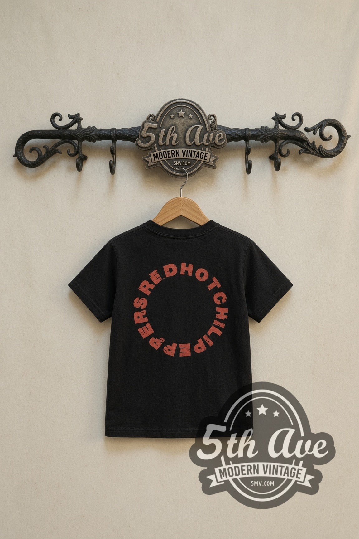Red Hot Chili Peppers Asterisk Circle kids band tee in black, back view on a display rack