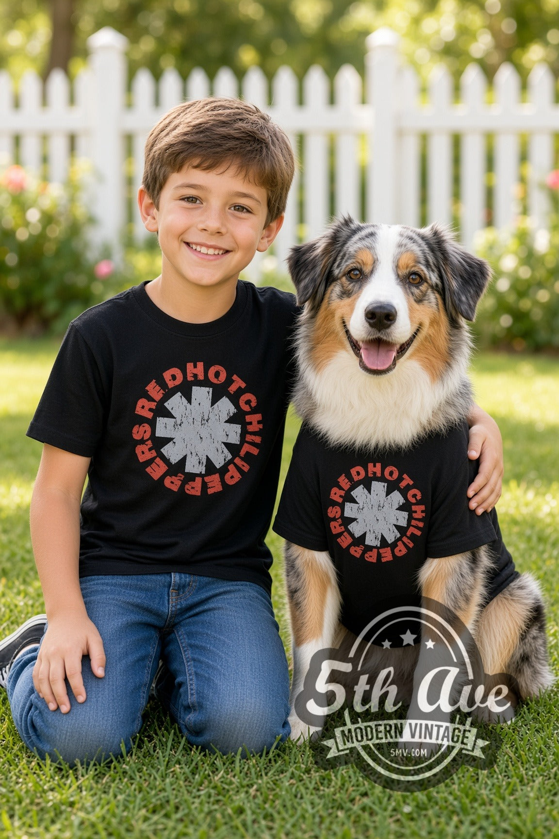 Child and dog both wearing the Red Hot Chili Peppers Asterisk Circle kids band tee in black