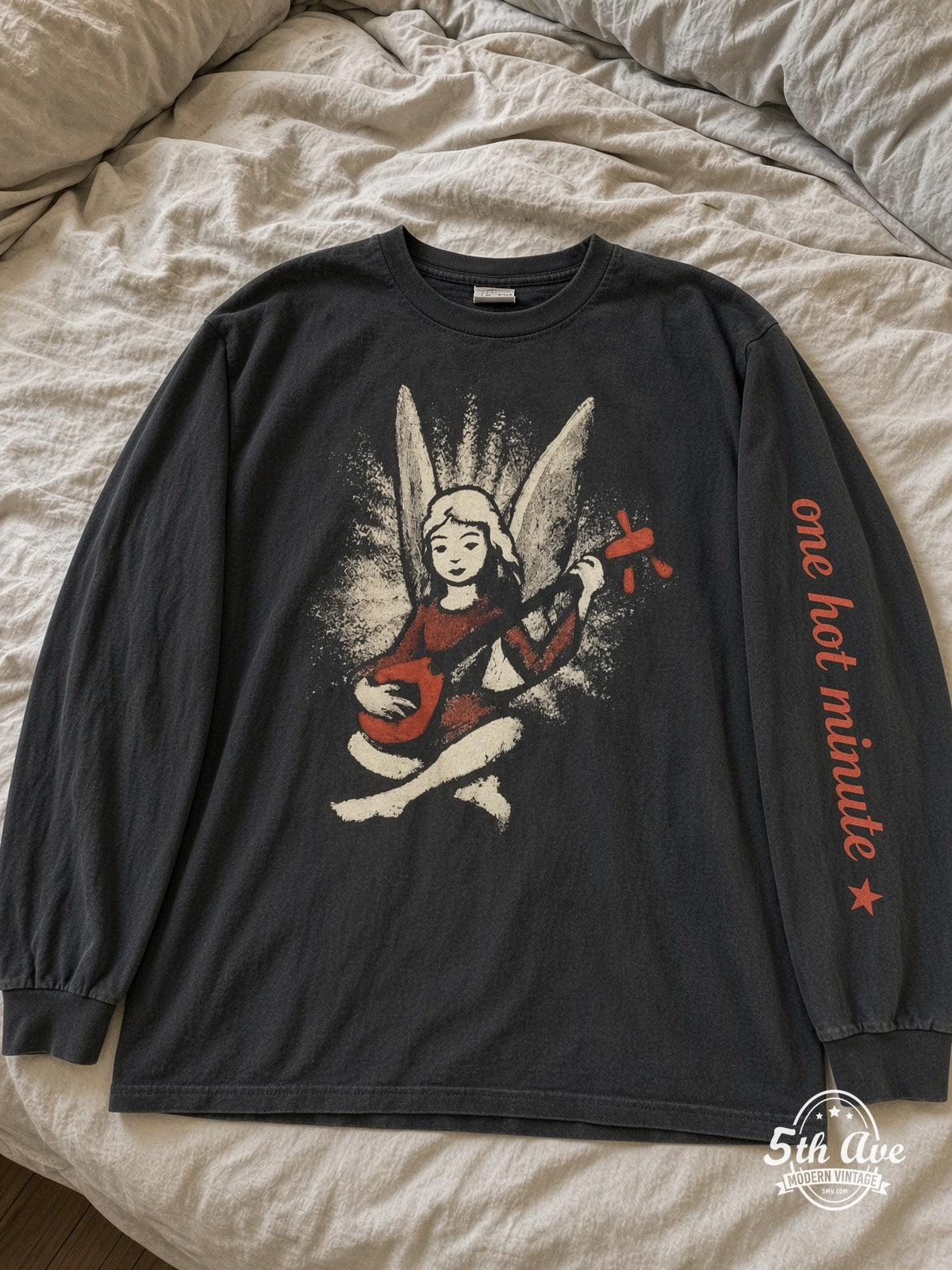 Red Hot Chili Peppers One Hot Minute World Tour 1996 vintage tee laid on bed