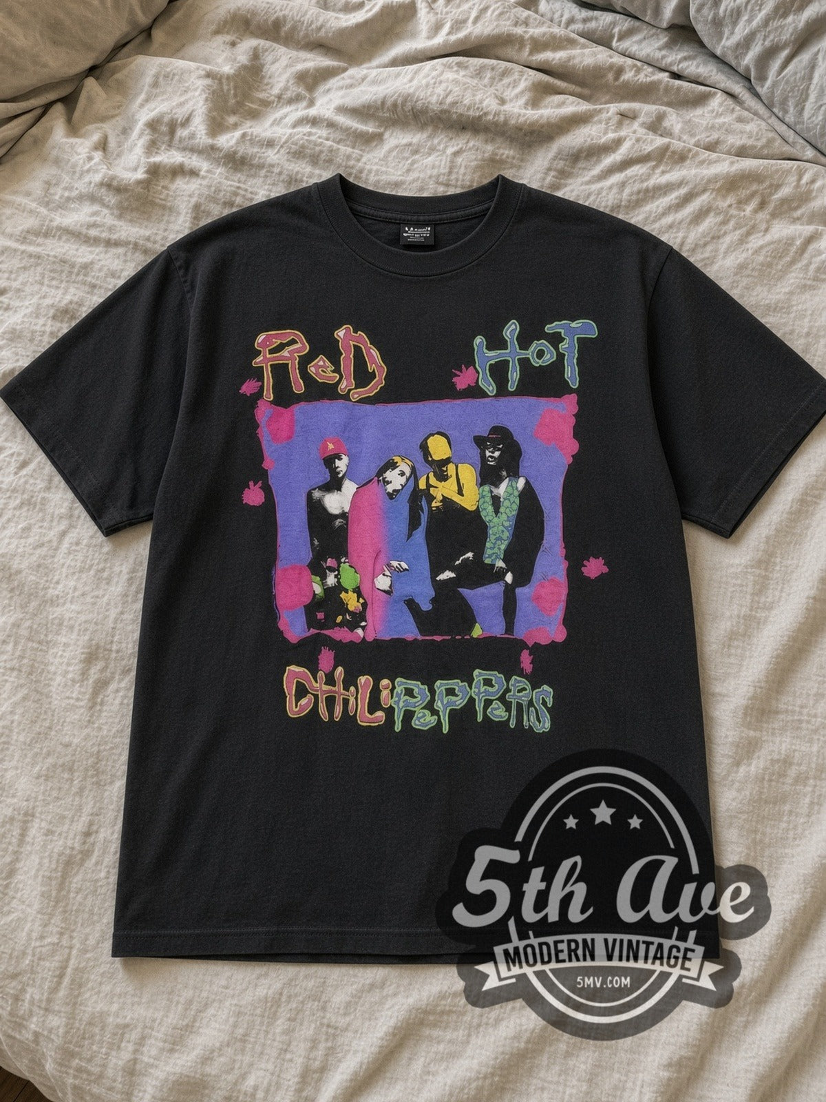Black Red Hot Chili Peppers Out With the Old Vintage Band T-Shirt laid flat on a linen bed
