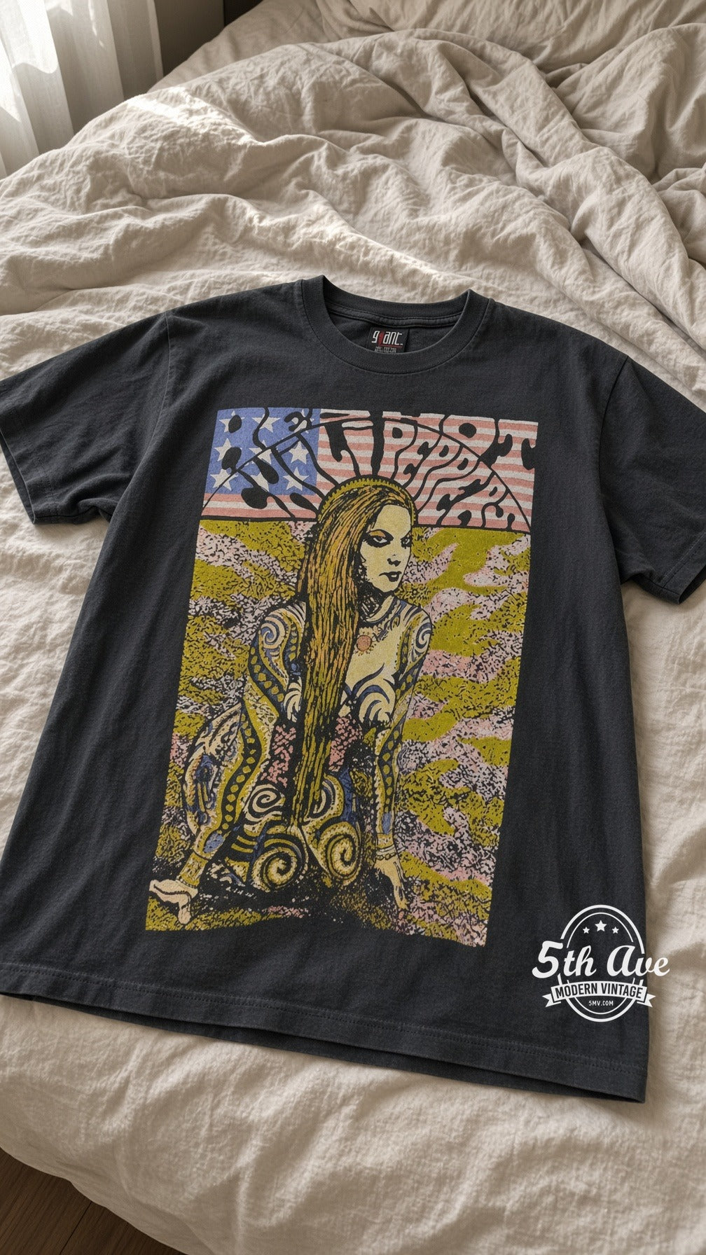 RHCP Tattooed Girl vintage t-shirt laid on bed