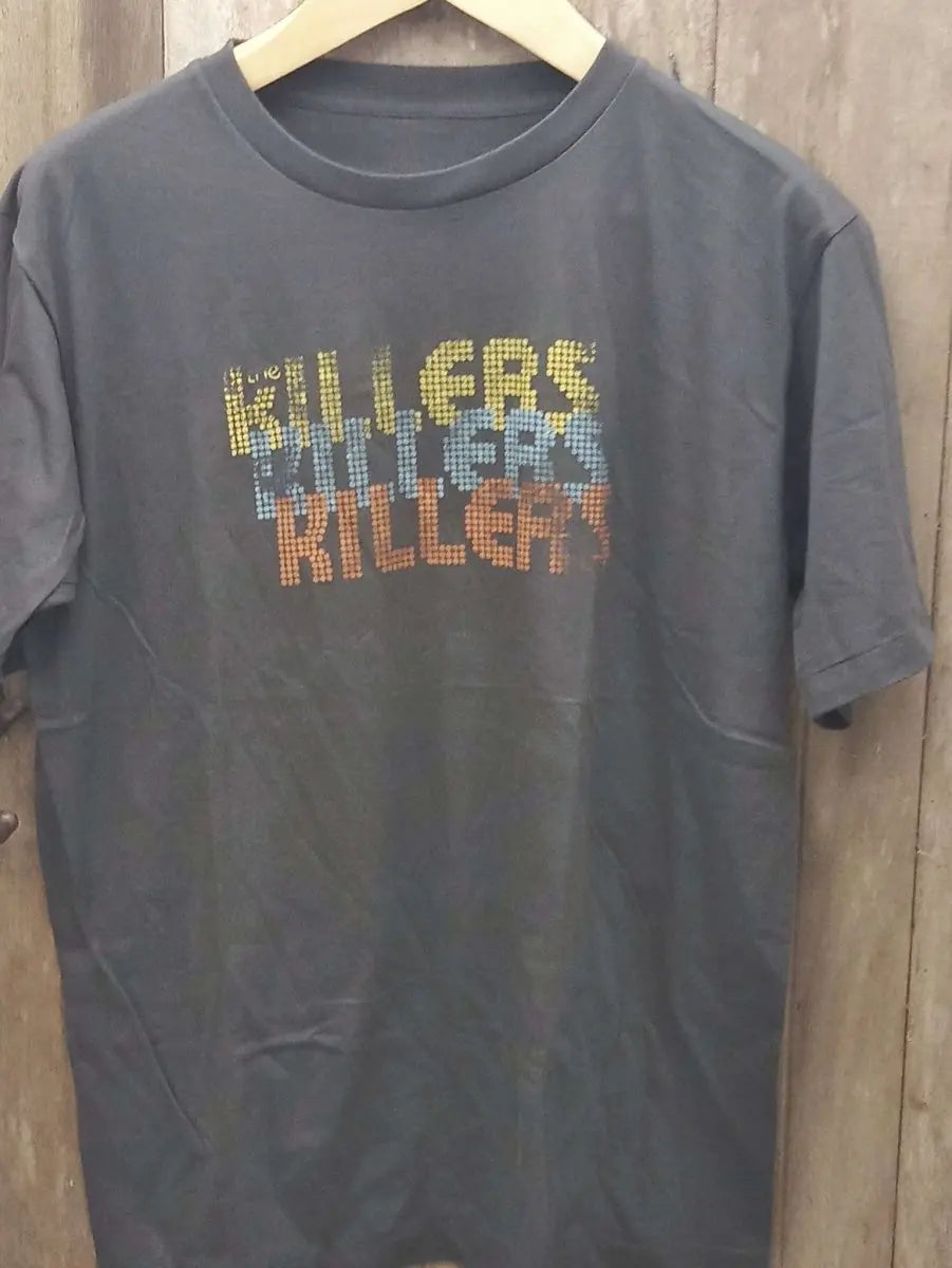 Retro Pixel Art Killers T-Shirt: Distressed Crewneck with Bold Typography in Yellow, Blue, and Red, 30-Day Return Guarantee - Vintage Band Shirts