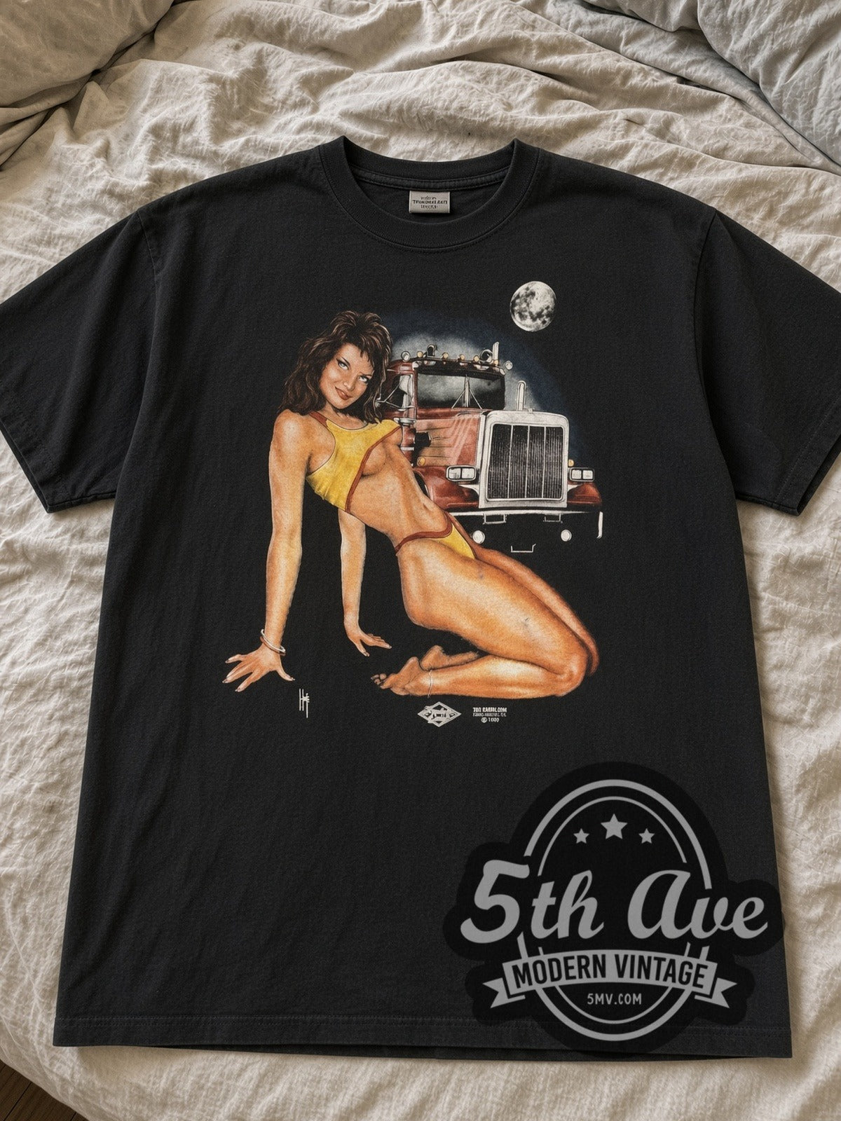 Black Roadway Motor Plazas Pin-Up & Semi Truck Moon tee laid flat on linen bed