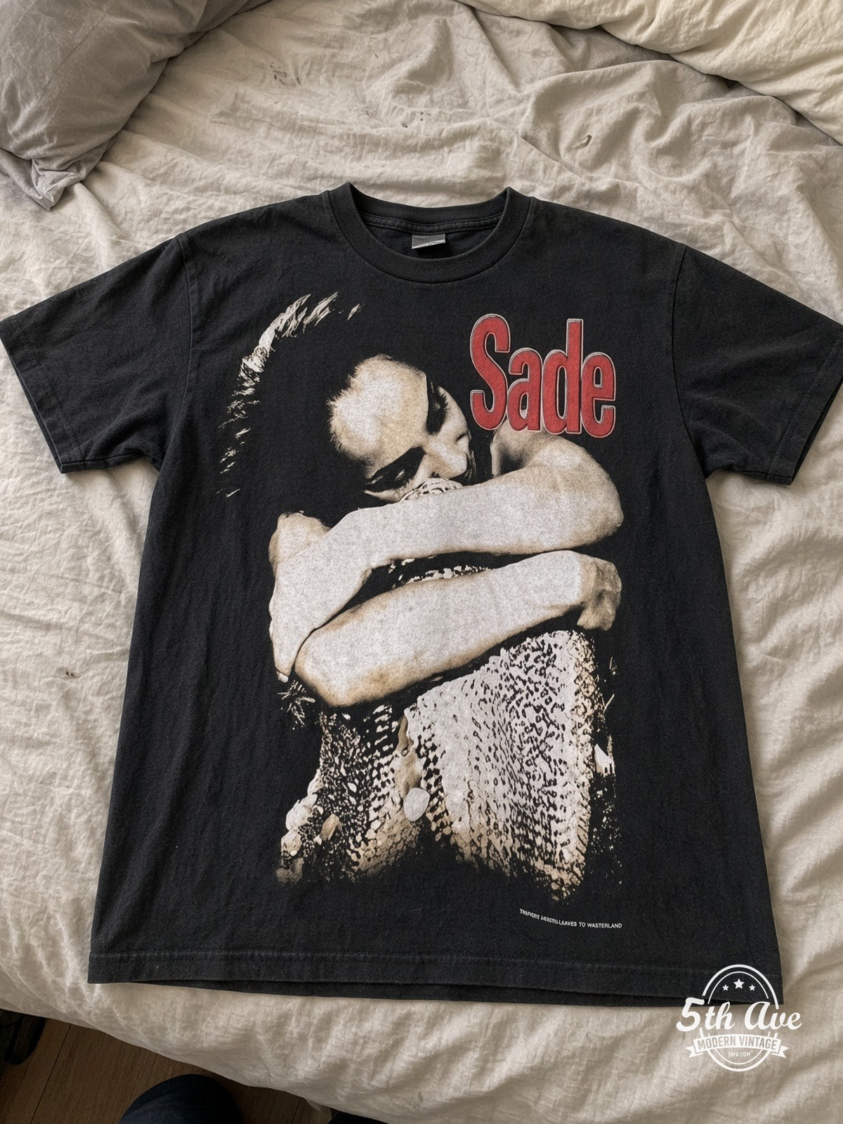 Sade Feels Like I'm in Paradise vintage tee laid on bed