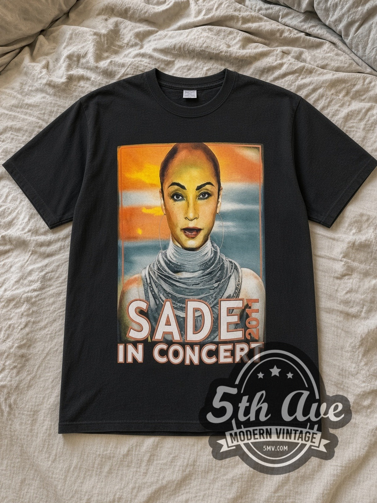 Black Sade Live in Concert 2011 Vintage Band T-Shirt laid flat on a linen bed