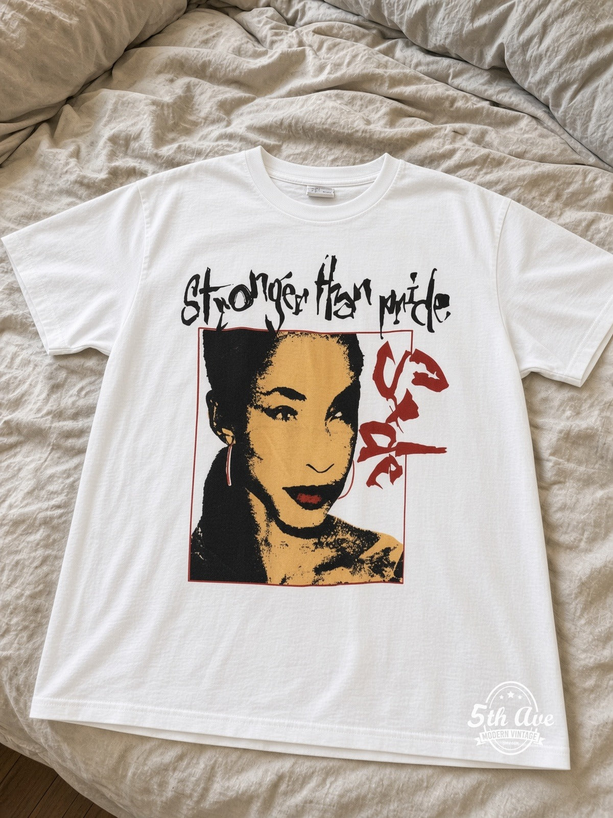 Sade Stronger Than Pride It's Paradise vintage tee laid on bed