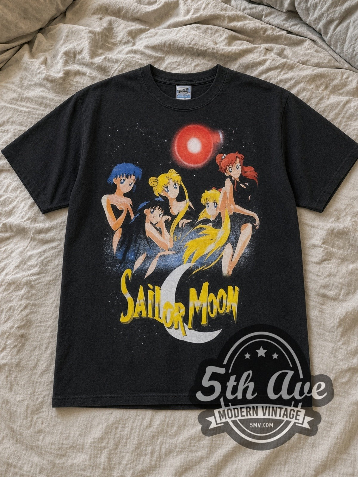Black Sailor Moon Five Sailor Guardians Transform Vintage Anime T-Shirt laid flat on a linen bed